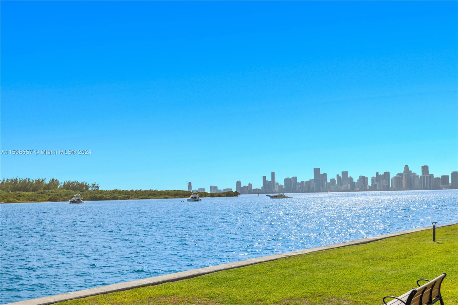 Rare opportunity to acquire a meticulously renovated ground floor 3BR unit on exclusive Fisher Island. Contemporary relaxed beachside decor with luxurious finishes, large plank wood flooring and raised high ceilings throughout.  Open contemporary gourmet kitchen features white marble countertops, stainless steel appliances, wine cooler for approx 40 bottles, nickel hardware, custom cabinetry and adjacent private office. Unit 2216 is an expanded coveted ground floor  “D” model and is of the most sought after split bedroom floor plans on the Island boasting a deep wraparound terrace with stunning panoramic Bay and Miami city skyline views and mesmerizing sunsets.  Custom built-ins abound.  All windows and doors are impact glass.