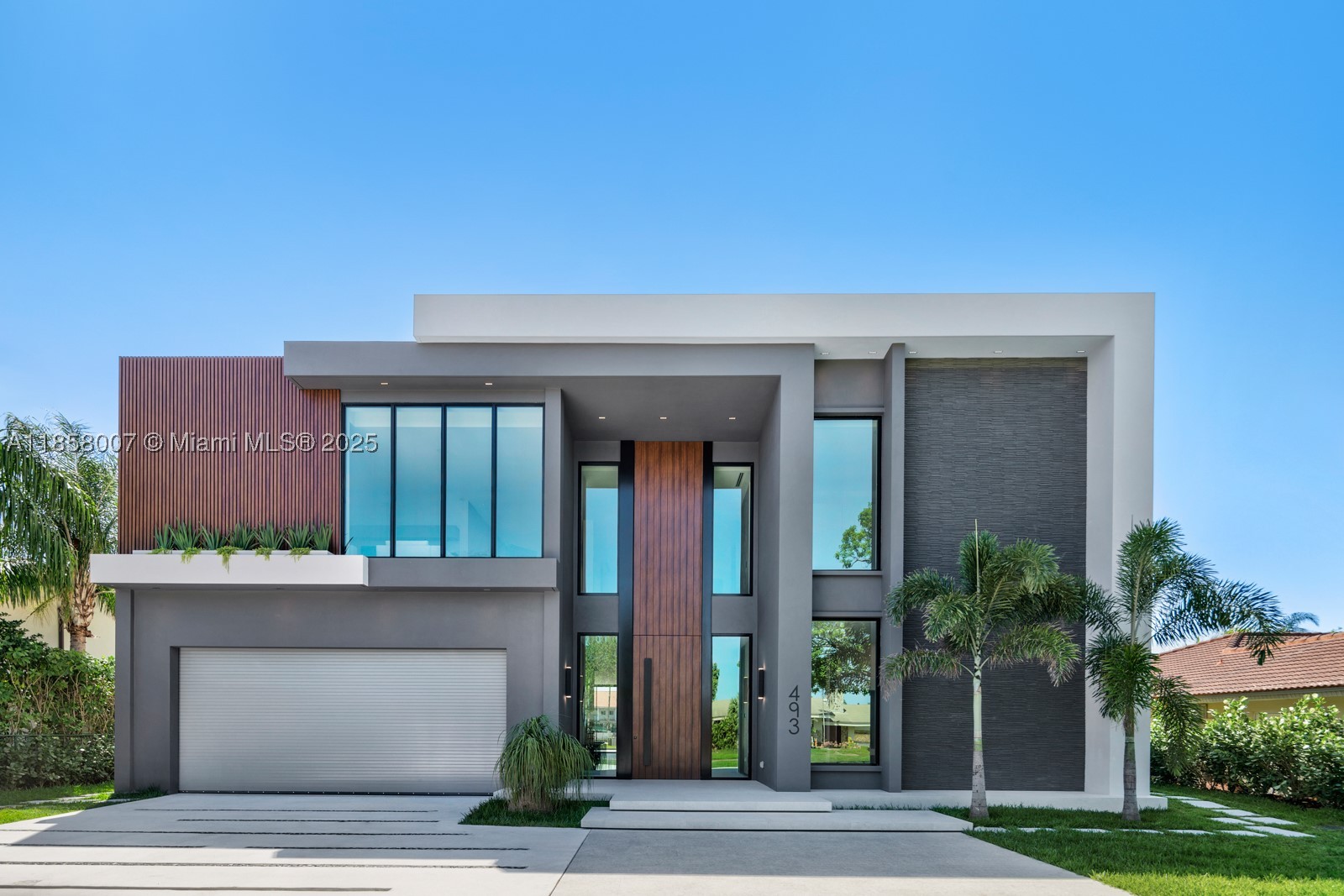 Crafted by Barreto Constructions, this 2024 new-construction waterfront estate presents a rare opportunity within the gated enclave of Golden Isles. Offering 9,536 total sq. ft., 85 feet of canal frontage, and direct ocean access with no fixed bridges, the residence combines architectural presence with immediate lifestyle execution.
Designed with 11-ft ceilings and expansive open living spaces, this 6BD/6BA/2HB modern home features 2 primary bedrooms,  a Mia Cucina Italian marble kitchen, integrated smart home and smart glass systems, premium sound, dual coffee stations, and a 160+ bottle temperature-controlled wine cellar.
Outdoor living is elevated with a resort-style pool and spa, covered terrace, summer kitchen with draft beer system, and upper-level wet bar. A newly constructed seawall built to current regulations and private dock enhance long-term waterfront integrity.
Additional highlights include a rare 979 SF climate-controlled collector’s garage within a 4-car configuration, spacious drive way for 6+ cars, Laundry Jet system, steam/dry-cleaning station, and 1,494 SF of finished terraces and balconies.
Fully completed and move-in ready, this 2024 new-construction waterfront situated in Golden Isles, gated community with parks, dog park, multiple tennis courts, it is minutes from beaches, golf, casino, and Aventura Mall.