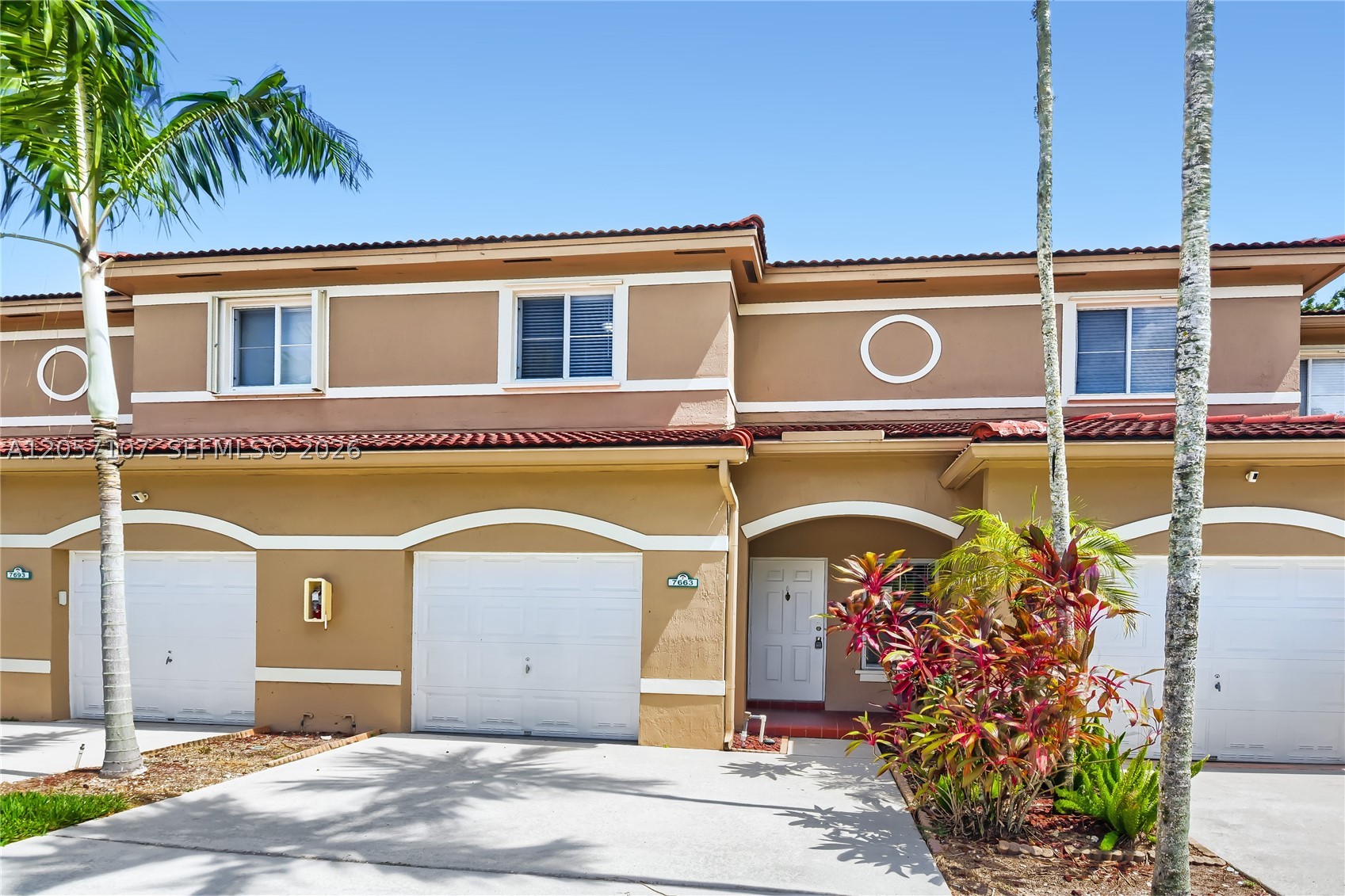 Charming townhome nestled in a peaceful, highly desirable neighborhood in Davie! This impressive 4-bedroom, 3-bathroom single-family residence features a spacious 1,724 square foot layout designed for effortless entertaining, cooking, and daily relaxation. Step inside to discover a bright and airy open-concept floor plan accented by gorgeous, eye-catching tile flooring and modern luxury vinyl plank finishes throughout the main living areas. The centerpiece kitchen comes fully equipped with solid surface countertops, sleek stainless steel appliances, custom cabinetry, and plenty of prep space for home chefs. Retreat to the comfortable, well-proportioned bedrooms, including a serene primary suite. Step outside to your private, attractive fenced backyard—featuring a cozy open patio space made for soaking up the South Florida sunshine, outdoor grilling, or watching the stars. Notable highlights include an attached garage, in-unit laundry hookups, and recessed lighting. Unbeatable Broward County location just minutes from top-rated public schools (including Silver Ridge Elementary), Nova Southeastern University, scenic parks like Tree Tops Park and Flamingo Gardens, premium dining, and major commuter routes.
