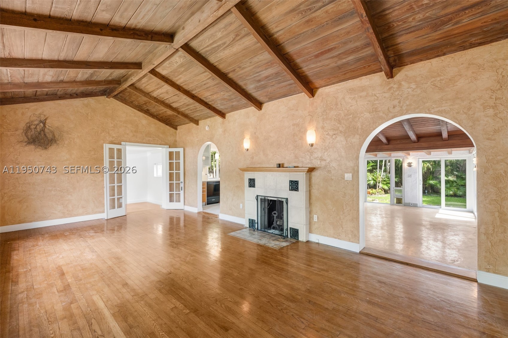 A desirable and highly sought-after area protected 24/7 by Miami Dade Police Patrol and hosting some of the best schools in Miami. A friendly neighborhood in a strategic location by the Business District. Kennedy Park is just around the corner. Among the above perks this house also offers along with its elegant vaulted wooden ceilings in the large living room with fireplace and also in the family room overlooking the wide tropical backyard through the large wall windows, a modern,functional kitchen inspires a novice cook to have a great experience upon its convenient gas stove.2 ensuites +1/1. Fully fenced,auto sprinklers system,front/back yard auto light system among the plants for an impressive night look,impact doors/windows,alarm system.Outside walls and roof freshly painted.