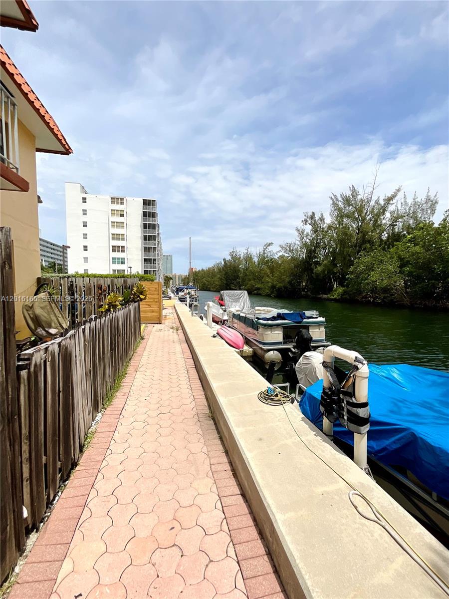 Location. Location. Location. Spacious 2 bedroom, 1 bathroom, ground floor unit in the prestigious neighborhood of Eastern Shores. This cozy condo features a remodeled bathroom, a brand new a/c unit, was freshly painted and is ready for move-in. 
The unit is located in a garden-style, boutique condo on the intracoastal, within walking distance to the Intracoastal Mall on 163rd Street, Sunny Isles Beach and much more. The condo features a community dock for residents to leisurely relax and unwind on the water. 
Priced to sell. Motivated seller. Spacious starter unit in an amazing location.