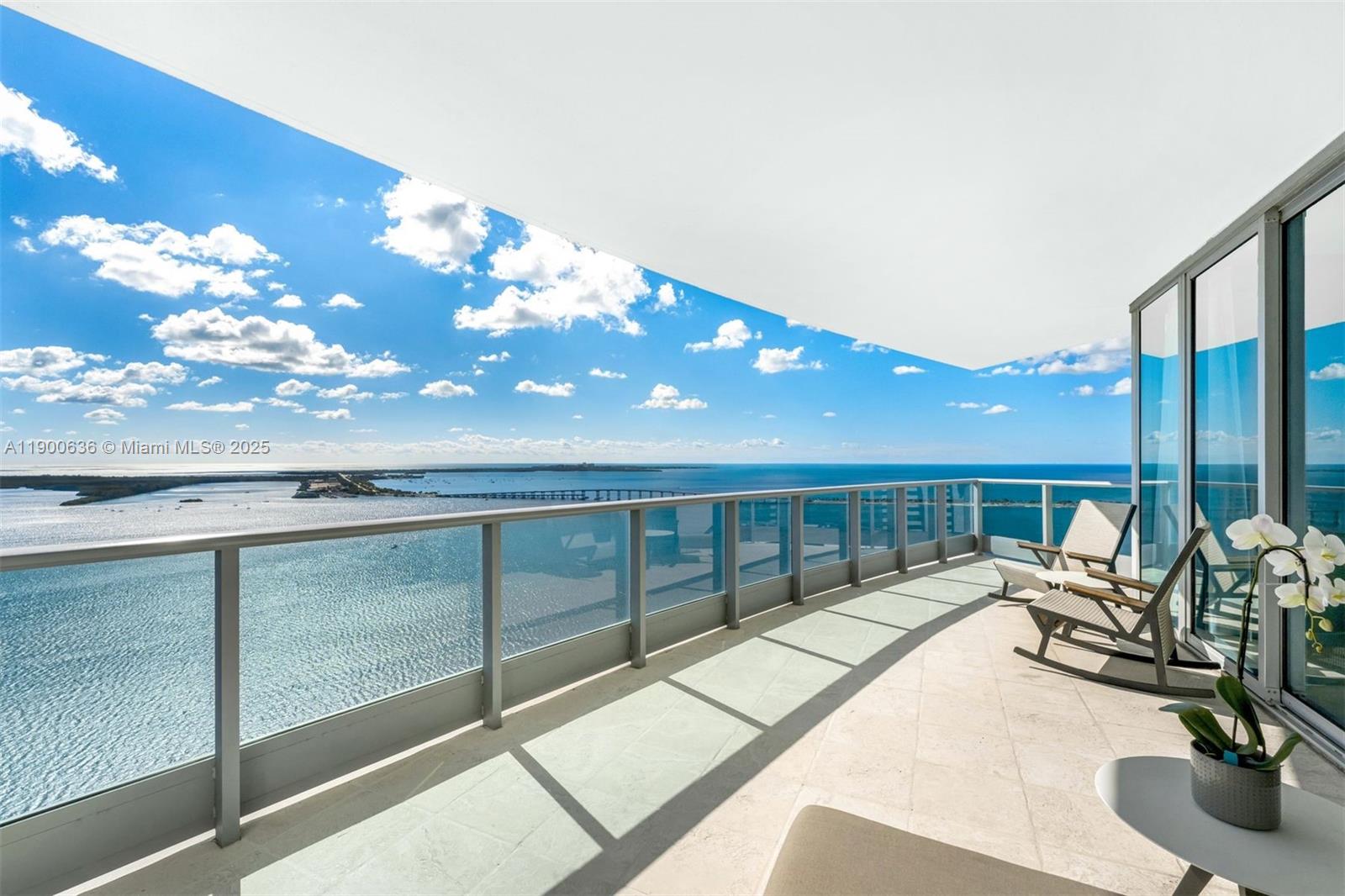 Experience Miami luxury at its finest in this 4-bedroom, 4.5-bath corner residence at JADE Brickell offering 3,415 SF of refined living space. Three expansive terraces showcase sunrise-to-sunset views of Biscayne Bay and the Miami skyline. The open layout connects spacious living areas w/floor-to-ceiling soundproof windows that fill the home w/natural light. Designer finishes include high ceilings, honed Saturnia marble, hardwood floors & a renovated chef’s kitchen w/Miele & Sub-Zero appliances, built-in coffee maker & dual wine coolers. The primary suite offers a spa-style bath & custom walk-in closet. Highlights include 4 parking spaces, private storage & elevator entry. Enjoy resort-style amenities & waterfront living in the heart of Brickell; the perfect blend of space, design & views.
