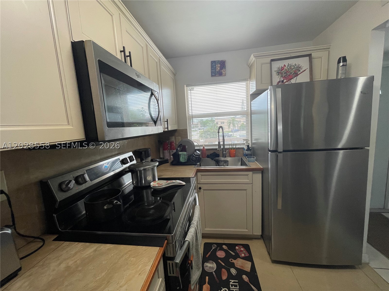 CAN BE SHOWN ANYTIME. EASY TO SHOW ON A LOCK BOX. Meticulously maintained, light, bright and cheerful 2/2 on second floor with open concept main living area. New AC, New tankless water heater, New Hurricane Impact front door, New recessed lights, New electric panel. The kitchen has been remodeled to include nice cabinetry and stainless steel appliances. The bathrooms have also been remodeled to include new cabinetry and LED lighting. The guest bedroom has 2 closets! The walk-in closet in the master bedroom has been given custom shelving and the view from the spacious screened balcony is spectacular. Hurricane protection is from roll up shutters. Sunrise Lakes Phase 3 is a resort style community with a golf course, 10 swimming pools, several tennis courts, a gym and an array of activities which allows one to be as busy on a daily basis as the owner desires. Run don't walk