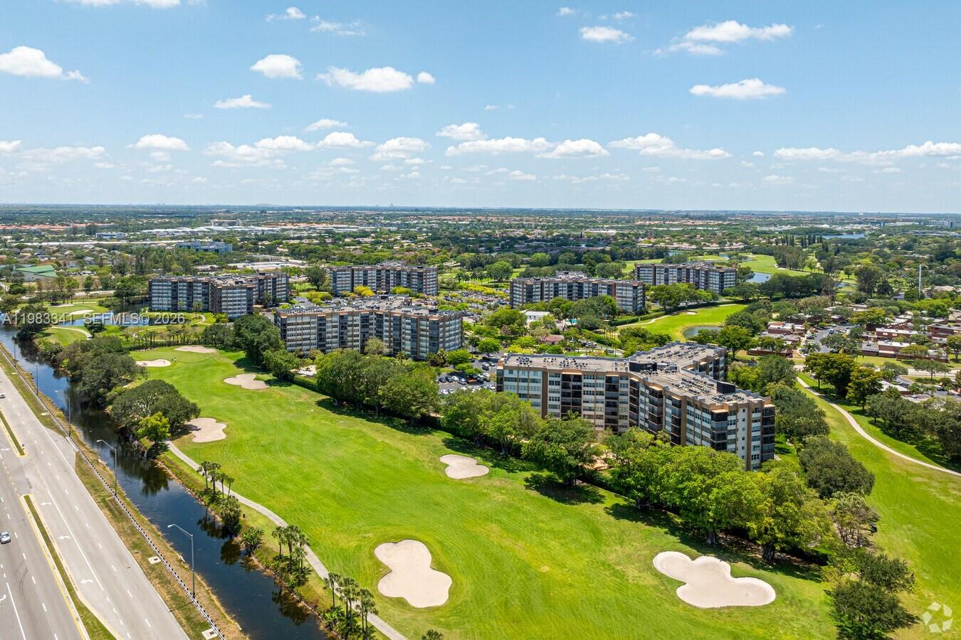 Bright corner unit oversized windows and abundant natural lighting. Located in  the last building  1981 at the end of the complex, this quiet unit is surrounded by a 37-acre golf course and offers the privacy 24/7 security. Enjoy amenities like: Clubhouse/Amenity Center with card room, ballroom, computers, and billiards. Walking & biking trails. Tennis courts. Parks & natural space. 4 Outdoor heated pools with changing rooms. With 1,028 units across six buildings, the complex is nestled near a one-mile walking/bike path. Park Place offers convenient access to Restaurant, Mall, Publix, Walgreens, CVS, Home Depot, and more.
