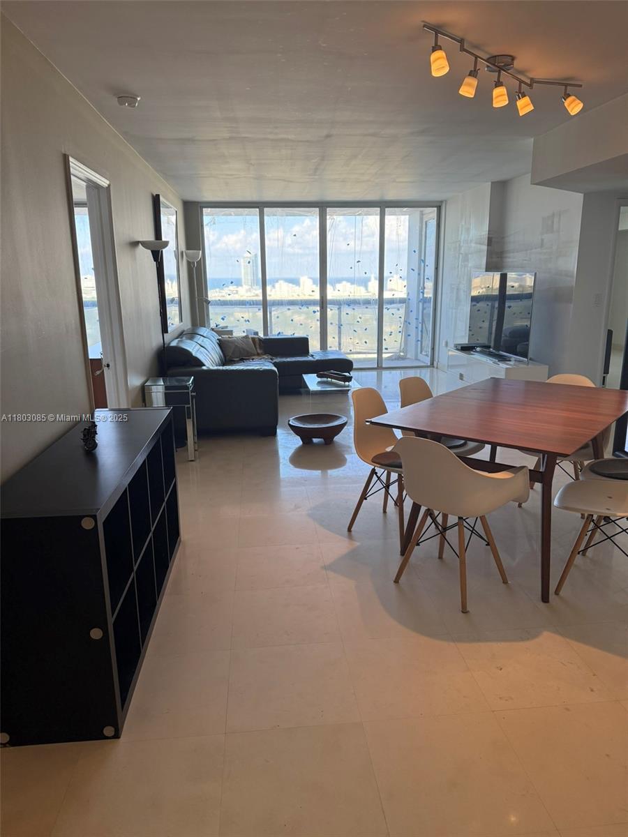 BREATHTAKING PANORAMIC VIEWS!LINE 11  24TH FLOOR SQFT 1380 2/2 Live the Miami dream lifestyle in this waterfront condo, high above Sunset Harbour Yacht Club. Stylish 2/2 with wall to wall sliding glass framing endless views of Biscayne Bay, Miami skyline + the private marina. Host your next cocktail party on the private 30 foot terrace! Classic marble floors, sleek , generous walk-in closets, One garage + 1 free valet space + electric charging keeps you mobile. doorman, 2 pools, gym, sauna + storage. Your new playground is the most dynamic neighborhood with a waterfront boardwalk, gourmet restaurants, local cafes, fitness boutiques like Sweat440 and Barry's Bootcamp, water sports, playgrounds + shopping.