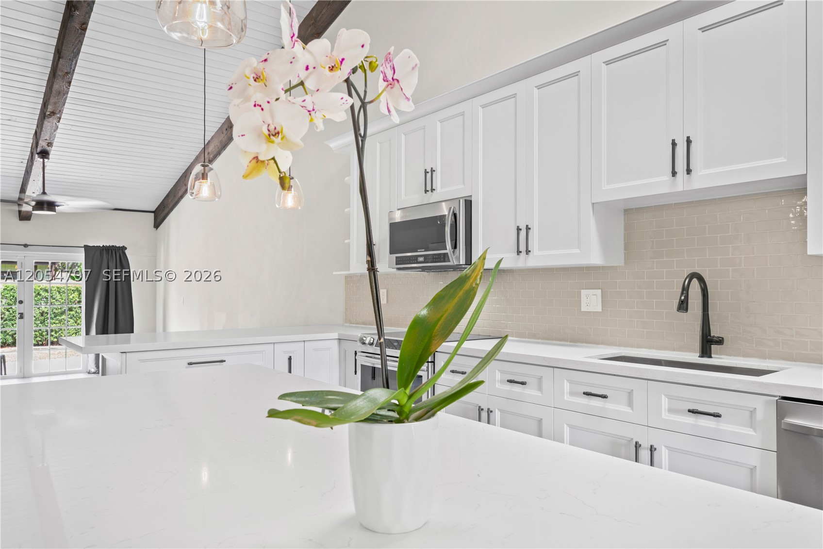 Some homes seem like they're fit for a fairytale ending. Welcome to this dream Villa in the heart of Pembroke Pines! Its soaring Vaulted Ceilings which display majestic & rare natural cedar wood beams and its luxury porcelain plank tile floors will take your breath away from the moment you step inside to realize that everything you've been looking for is finally here. Boasting a gorgeous gourmet kitchen that offers an oversized island which is highlighted by beautiful hanging light fixtures, calacatta quartz, separate pantry, & all new high end appliances including a new wine chiller & beautiful views of the backyard. One of the many unique features of this home is the loft which can be used as a guest suite, library or game room for kids! Both spacious rooms offer the luxury of stunning vaulted ceilings along with their own remodeled ensuite and walk-in closets for comfort. Enjoy direct access from both the master bedroom & living area to the perfect backyard which offers the ideal blend of perfectly manicured low maintenance landscaping, a brand new fence, and paved patio perfect for entertaining or simply uncorking & unwinding to a beautiful sunset. Additionally the home features 2 sheds for extra storage and 2 ring cameras. Situated on an Oversized Corner Lot, making this a rare opportunity to own a true gem in the sought after Cedarwoods community. Surrounded by great schools, shopping, restaurants & more this dream villa won't last! Open H: this Sat 10-12pm!