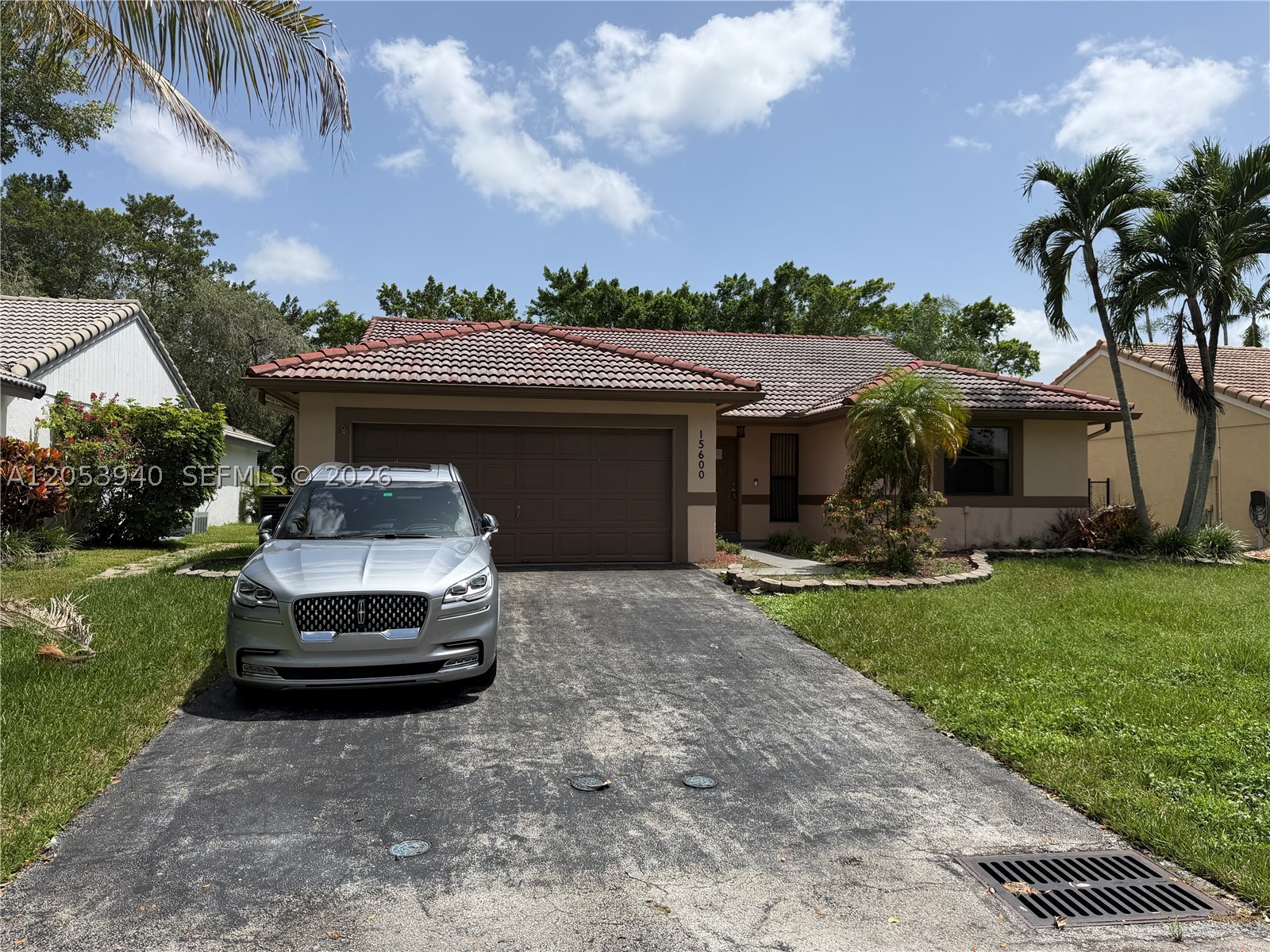 Sensational single-story pool home located in a highly desirable, quiet neighborhood in West Davie! This exceptional 3-bedroom, 2-bathroom single-family residence features a spacious 1,745 square foot layout perfectly designed for modern living and seamless entertaining. Step inside through an inviting entryway to find bright, airy common spaces accented by beautiful, low-maintenance tile flooring throughout. The open kitchen comes beautifully equipped with elegant solid surface countertops, coordinating appliances, and plenty of cabinet storage space for effortless meal prep. Retreat to the spacious bedrooms, or step out back to your private, fully fenced backyard oasis—highlighted by a sparkling swimming pool and an attractive patio space made for weekend BBQs, lounging, or relaxing under the stars. Notable features include an attached garage, central air conditioning, in-unit laundry hookups, and integrated smart home technology. The neighborhood features great community perks, including a nearby tot lot. Unbeatable location zoned for Broward County's top-rated, all "A" schools, with quick access to local parks, premium dining, shopping, and major transit routes for an easy commute.