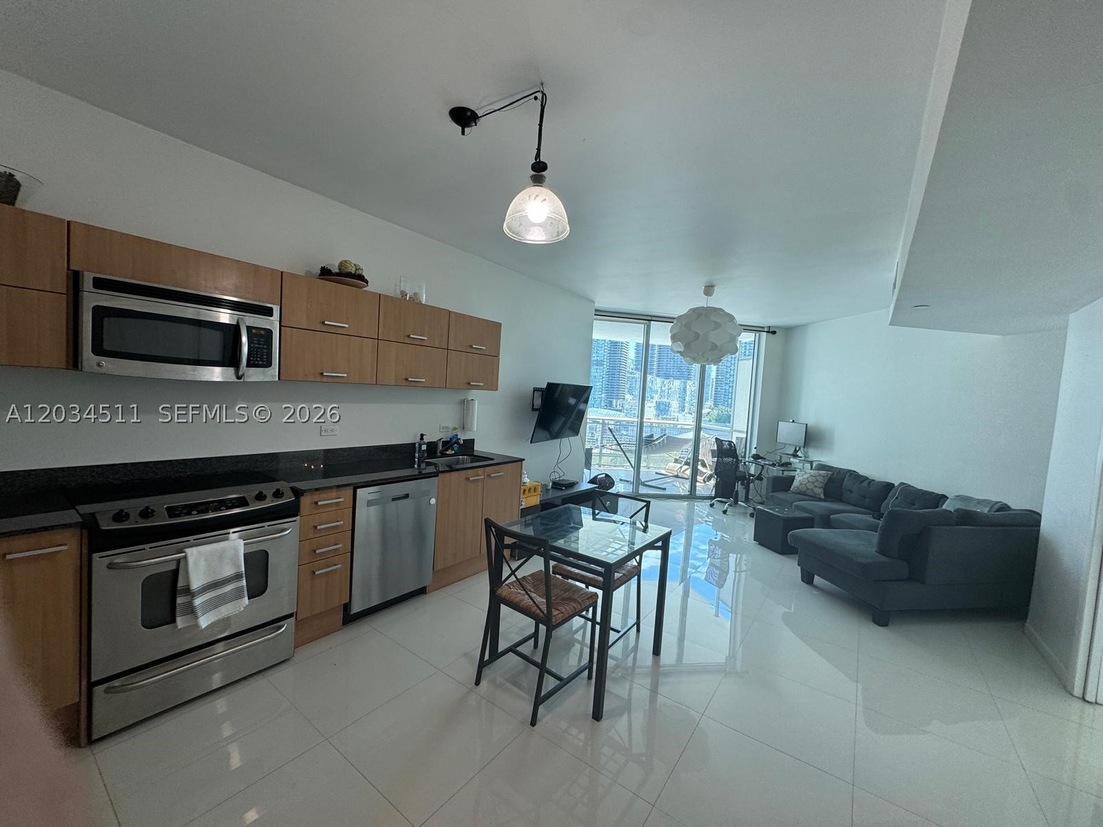 Experience vibrant city living in this bright and modern 1-bedroom, 1-bath residence located in the sought-after Wind Condominium. This well-appointed unit features tile flooring throughout, a sleek kitchen with stainless steel appliances, and an in-unit washer and dryer. Floor-to-ceiling windows bring in abundant natural light and open to a private balcony with gorgeous city and river views. One assigned parking space included. Enjoy resort-style amenities including a state-of-the-art gym, spa, racquetball court, pool, and more. Ideally located near the Miami River, just steps from Brickell’s top shopping, dining, and entertainment. Currently occupied—available for move-in after July 15th. 1st month of rent, security deposit and HOA deposit.