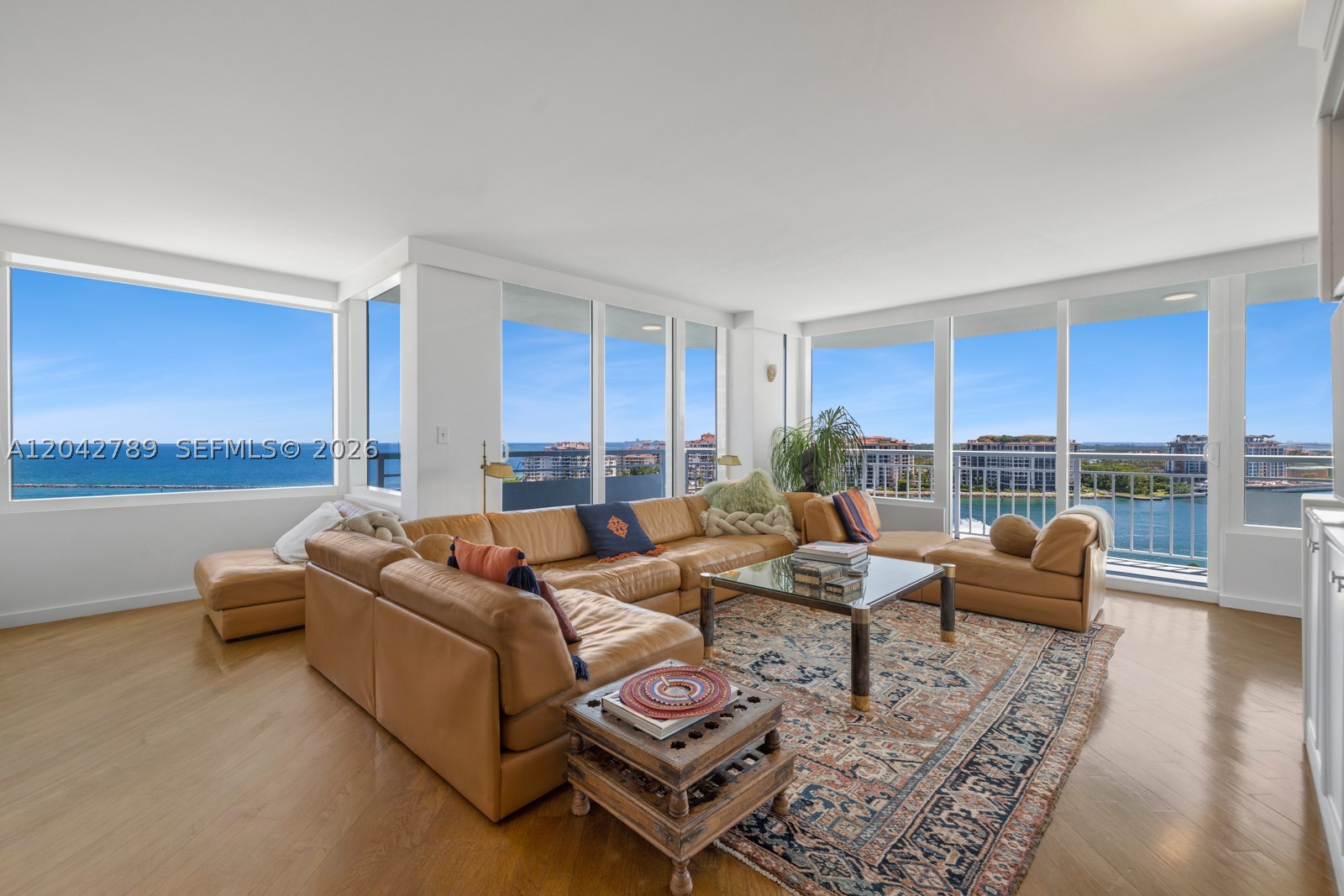 This one-of-a-kind home in the sky showcases breathtaking panoramic views of the ocean, Fisher Island & the Miami skyline throughout. Created by seamlessly combining two apartments into one expansive 3,073 SF residence, this unique offering delivers the scale and comfort of a single-family home with the ease of luxury condominium living. The thoughtfully designed layout features 3 bedrooms, 2 bathrooms, generous living and entertaining spaces, and walls of glass that frame stunning water and city views. Multiple balconies, hurricane impact windows & doors and a beautifully renovated kitchen make this sunlit oasis complete. Located in Miami Beach's highly coveted South of Fifth neighborhood, residents enjoy resort-style amenities and an unmatched walkable lifestyle just steps from pristine beaches, South Pointe Park, world-class dining and marinas. This unit boasts two rarely available 1-car garages for the most discerning car enthusiast. Enjoy utmost privacy and exclusivity throughout your serene retreat.