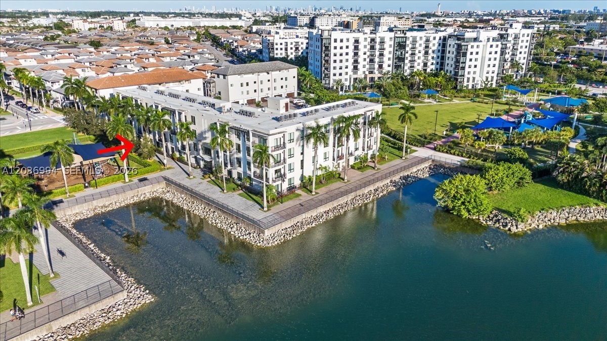 Gorgeous first floor 2 bedroom 2 bath apartment in the most desirable area of Doral; with two separate entrance, including a Next Gen private entry Suite/Studio with own bathroom and kitchenette, with 2 ring cameras and smart locks on the doors; balcony with playground and corner lake views. Quartz kitchen countertops, all ceramic tile floors, stainless steel appliances, open concept living area, impact windows, smart home system. Washer & Dryer inside the unit. Close to A+ schools, restaurants, supermarkets, retails and more. Property located on the 1st floor. Community offers resort style pool, clubhouse, fitness center, playgrounds, pools, a business center, indoor basketball courts, mini golf, dog park and more. It comes with two assigned parking spaces. Unfurnished.