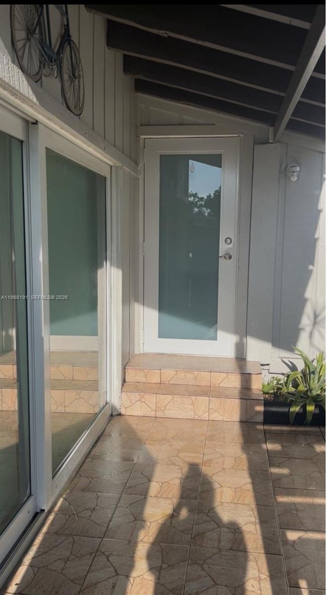 Spacious 3-bedroom, 3-bathroom townhouse featuring one full bedroom and bath on the first floor. Enjoy a remodeled open kitchen with granite countertops, updated bathrooms, fresh interior paint, and a large primary suite. Private backyard with fence. Located in a gated community with low HOA, offering 2 pools, tennis courts, and a scenic lake. Conveniently close to major highways, shopping, restaurants, Florida International University (FIU) and Miami Dade College. Currently rented through October 2026 — excellent opportunity for investors seeking immediate rental income.