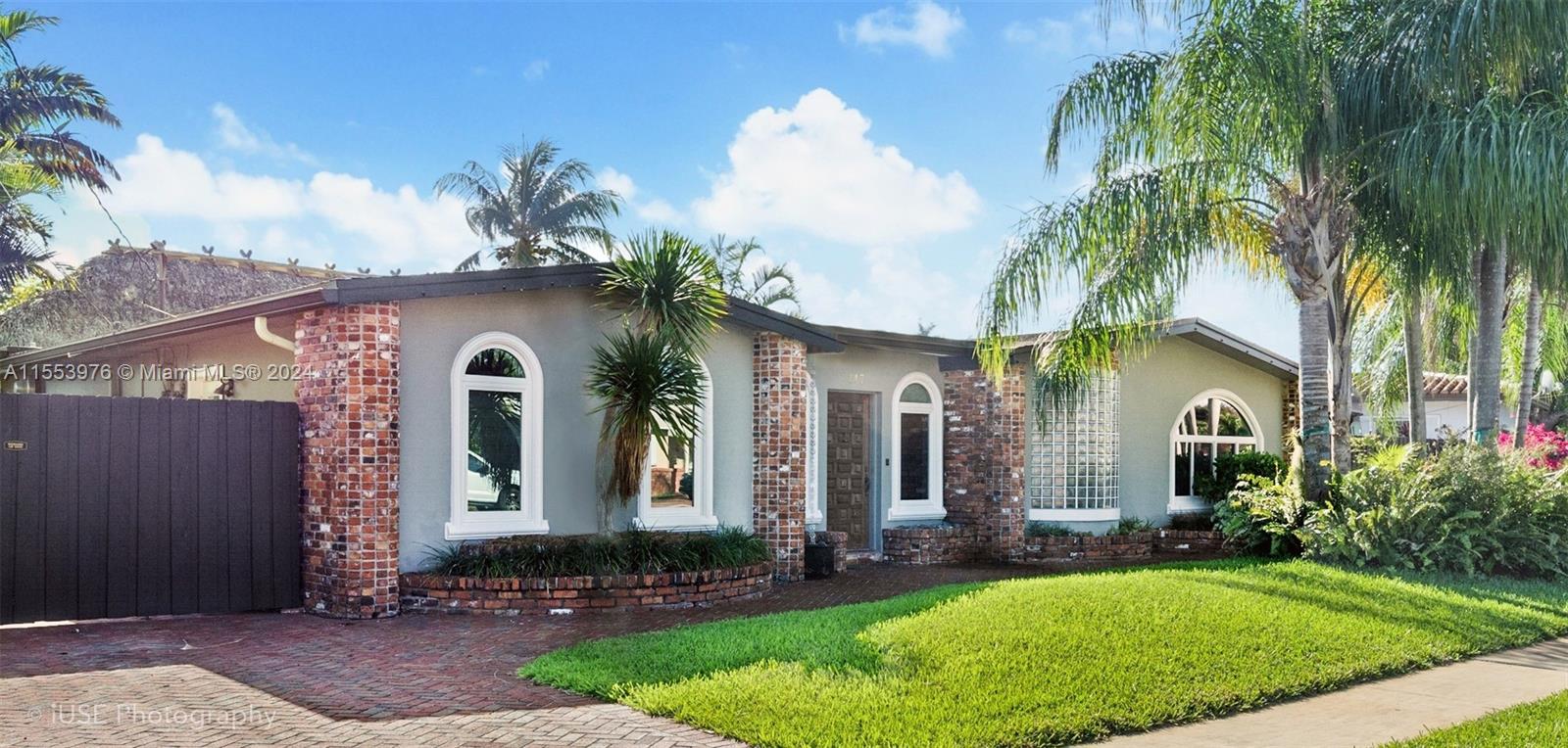 Private tropical paradise located on a hidden waterway with expansive canal/lake and park views. Property features gourmet Chef's kitchen with herb garden. Grand master suite with bath, 2 additional bedrooms with bath. Impact windows. Private cocktail lounge/bar, Tiki Hut covered patio. Waterfront stone patio and dock, great for entertaining.