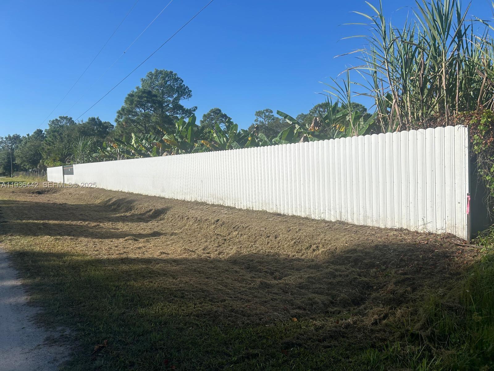Ready-to-build residential lot with over $80,000 in upgrades already completed. Property has been fully cleared and includes a compacted house pad approximately 70’ x 60’, elevated 2 feet above natural ground level for proper drainage and construction readiness.

Additional compacted areas provide ample space for parking boats, trailers, and multiple vehicles. Property features a private water well with concrete-poured well area, solar-powered light posts, and full perimeter fencing.

Includes a 20’ sliding entry gate, durable fencing with approximately 100’ of lateral fencing, and a covered canopy measuring approximately 11’ x 37’. An established fruit tree area adds long-term value.

Excellent opportunity to build immediately on a well-prepared 1.25-acre lot in Montura Ranches. Buyer to verify zoning, setbacks, utilities, and building requirements.

USDA-eligible area (buyer to verify). Financing options available through listing agent.