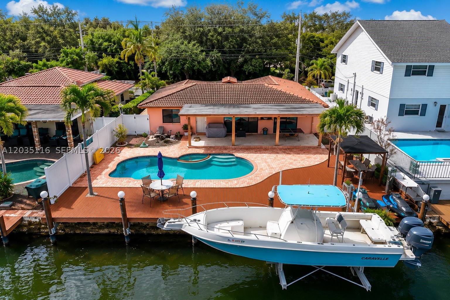 THIS NICE 1,417 SqFt UNDER AIR CONDITIONED HOME IS A GREAT OPPORTUNITY! WONDERFUL WATERFRONT HOUSE JUST LISTED ON THE MARKET, HURRICANE IMPACT WINDOWS AND DOORS. DEEPWATER OCEAN ACCESS WITH NO FIXED BRIDGES TO THE OCEAN, LOCATED EAST OF US-1 AND NO HOUSES ON OPPOSITE SIDE OF STREET. 2 YEAR OLD AIR CONDITIONER. IT HAS A NICE SALT SYSTEM POOL WITH PROGRAMABLE VARIABLE SPEED PUMP AND INTEGRATED JACUZZI. THERE IS A BIG BACKYARD WITH A COVERED PATIO FOR ENTERTAINING AND RELAXING WITH FAMILY AND FRIENDS, IN THIS BEAUTIFUL SOUTH FLORIDA WEATHER. THE HOUSE HAS A 50 FT DOCK WITH A 16,000 LB BOAT LIFT. A MUST SEE , DO NOT LOSE THIS OPPORTUNITY.