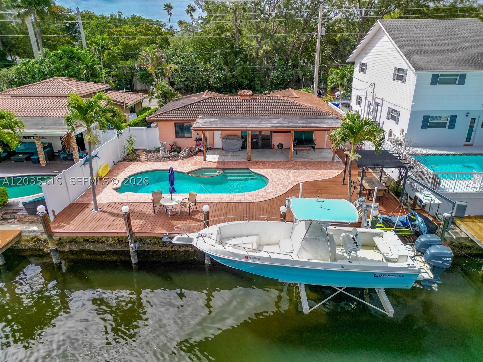 THIS NICE 1,417 SqFt UNDER AIR CONDITIONED HOME IS A GREAT OPPORTUNITY! WONDERFUL WATERFRONT HOUSE JUST LISTED ON THE MARKET, HURRICANE IMPACT WINDOWS AND DOORS. DEEPWATER OCEAN ACCESS WITH NO FIXED BRIDGES TO THE OCEAN, LOCATED EAST OF US-1 AND NO HOUSES ON OPPOSITE SIDE OF STREET. 2 YEAR OLD AIR CONDITIONER. IT HAS A NICE SALT SYSTEM POOL WITH PROGRAMABLE VARIABLE SPEED PUMP AND INTEGRATED JACUZZI. THERE IS A BIG BACKYARD WITH A COVERED PATIO FOR ENTERTAINING AND RELAXING WITH FAMILY AND FRIENDS, IN THIS BEAUTIFUL SOUTH FLORIDA WEATHER. THE HOUSE HAS A 50 FT DOCK WITH A 18,000 LB BOAT LIFT. A MUST SEE , DO NOT LOSE THIS OPPORTUNITY.