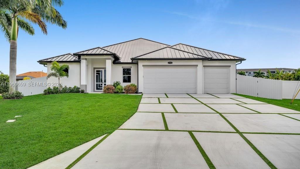 Welcome to this brand-new 2025 construction in one of Cape Coral’s most sought-after waterfront neighborhoods! This stunning 4-bedroom, 3-bath home delivers 2,554 sq ft of thoughtfully designed living space (with an impressive ~4,000 sq ft under air) on a rare 0.53-acre oversized lot featuring sweeping water views of intersecting canals and a massive basin—larger than many city lakes.
Step through the front door into an open-concept great room that flows seamlessly into a gourmet kitchen highlighted by a striking white marble island, crisp white cabinetry, and elegant pendant lighting. High-end finishes, abundant natural light, and premium touches elevate every inch of this modern Florida retreat.
The spacious primary suite offers a true owner’s oasis, while the additional bedrooms provide flexibility for family, guests, or a home office. Outdoor living shines with expansive views from the rear—perfect for morning coffee or sunset gatherings. The enormous lot opens up endless possibilities: a dream garage, mother-in-law suite, or future pool/lanai expansion, all while maintaining gulf-access boating just minutes away.
Located in a prime spot near top-rated schools, shopping, dining, and all the amenities Cape Coral is famous for, this home combines luxury, privacy, and investment potential on one of the largest remaining view lots in the area.
Schedule your private showing today and experience exceptional Florida living at its finest!