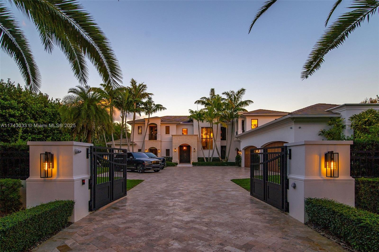 Opulent Oasis of Stritter Estates - as functional as it is beautiful. Gated smart home exudes sophistication at every turn. Lots of natural light permeates through oversized windows into an open floor plan, inviting you to enjoy SoFL living! Hold court in the majestic chef’s kitchen and family room that seamlessly integrate with the idyllic grounds. Entertain in style with the state-of-the-art movie theatre/bar, fully-equipped gym, and multiple ensuite bedrooms with walk-in closets and access to private terraces. The grand covered outdoor patio is an entertainer's dream, with elegant arches, built-in fans, and recessed ceilings. Enjoy the ivy wall, outdoor kitchen, and a gas fire pit while taking in the breathtaking view of the fountain, saltwater pool/spa & turfed area w/playground.