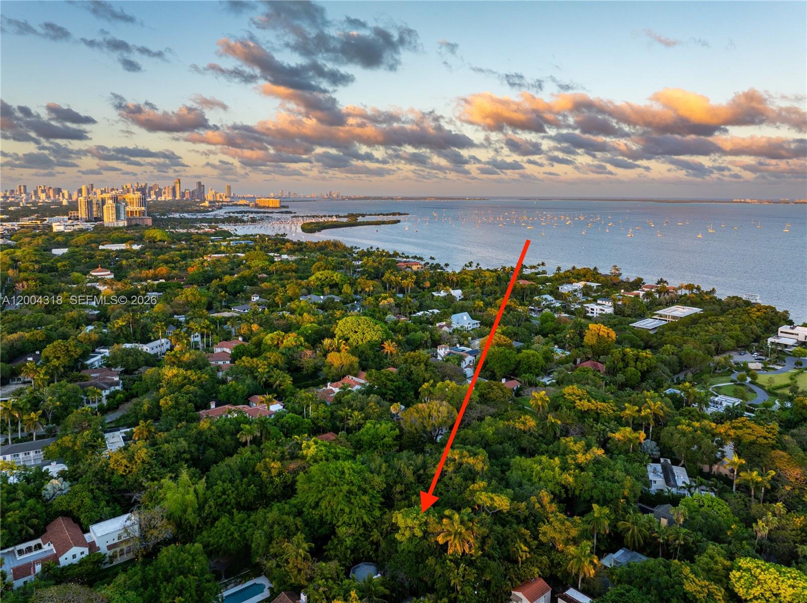 Tucked along one of Coconut Grove’s most coveted streets, this enchanting cottage offers a rare blend of charm and privacy. Set on an expansive 15,710-square-foot lot, the property is surrounded by lush, mature landscaping and anchored by a stunning pool that creates a true backyard oasis. Intricate wrought iron gates welcome you into the residence, where coral rock accents and an open-concept layout lend warmth, character, and effortless flow throughout the home.  Enjoy the home as-is, expand, or build new on one of Miami’s premier streets with sparkling views of Biscayne Bay.