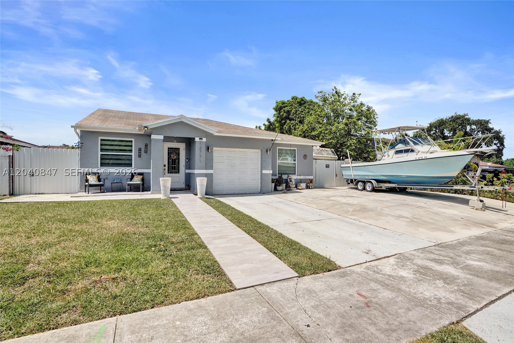 Beautifully remodeled 3-bedroom, 2-bath home in Homestead. No HOA and plenty of space for a boat, RV, trailer, and multiple vehicles. Features an open-concept layout, porcelain tile floors, updated bathrooms, and a modern kitchen with quartz waterfall countertops, custom cabinetry, stainless steel appliances, and a large island. Enjoy the private backyard with an above-ground pool, covered outdoor kitchen, gazebo, and ample entertaining space. Conveniently located near shopping, schools, dining, and major highways.