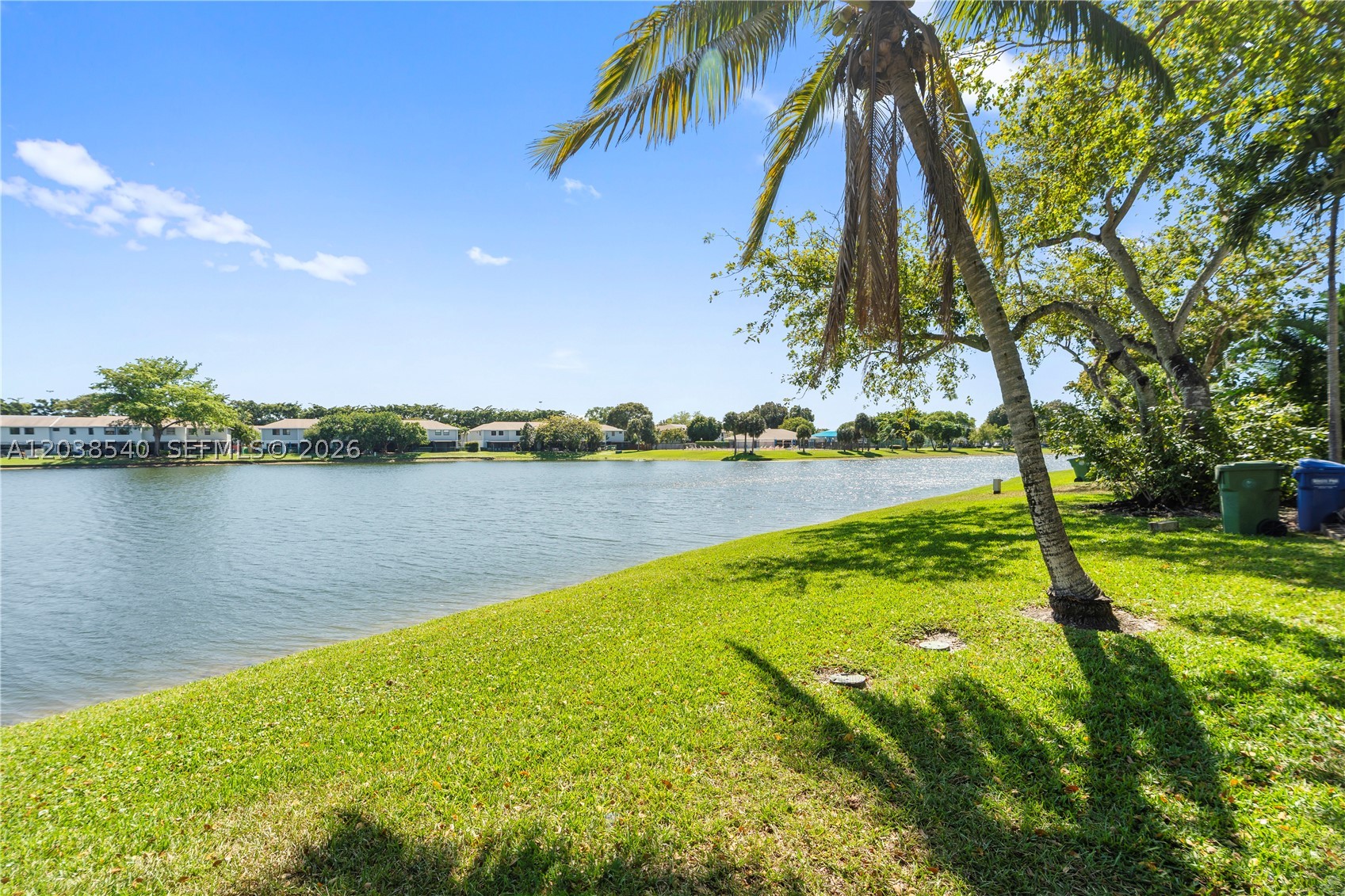 Excellent income Opportunity for Investors and a great option for Homeowners. Stunning 2-bedroom, 2-bathroom corner residence with breathtaking lake views from its balcony. Its prime corner location offers added privacy, creating a serene atmosphere. This comfortable home features an excellent layout with separate bedrooms. This beautiful condominium is move-in ready, with a beautifully redesigned kitchen featuring S. S. Appliances, elegant wood cabinetry, and granite countertops. Tile flooring throughout combines modern style with easy maintenance. Updated bathrooms. Additional upgrades include crown molding, accordion blinds, and the convenience of an in-unit washer and dryer. Lago Grande amenities include a clubhouse, three swimming pools, basketball courts, and a playground. Ideal location, excellent schools, close to shopping and dining. Easy access to major highways such as I-75 and the Palmetto Expressway. Low Manteinance (HOA) fees. SELLER MOTIVATED