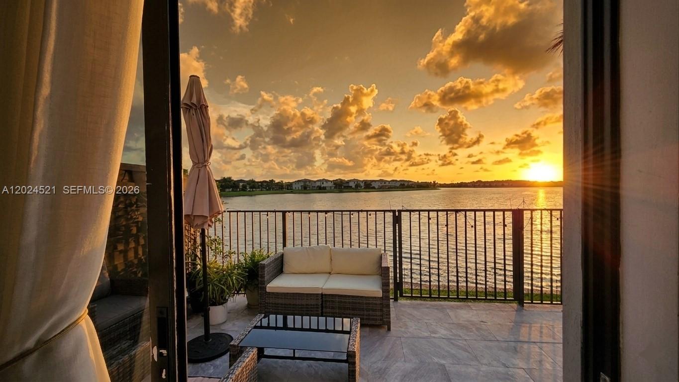 Beautiful lakefront 4-bedroom, 3.5-bath townhome located in the highly sought-after gated community of Satori in Miami Lakes. This spacious two-story residence offers approximately 1,908 sqft with a bright open layout, abundant natural light, and peaceful water views that immediately make you feel at home.

The backyard is truly one of the highlights of the property, featuring a private waterfront setting perfect for relaxing, entertaining, family gatherings, or simply enjoying the sunset overlooking the lake. The open water views and added privacy create a rare outdoor experience not commonly found in townhome living.

The home has been very well maintained and includes upgraded upstairs flooring replacing the original carpet, a whole-home water filtration system, and a functional layout with one full bedroom and bathroom downstairs ideal for guests, extended family, or a home office.

Upstairs, the spacious primary suite overlooks the lake creating a peaceful retreat feel. Residents of Satori enjoy resort-style amenities including clubhouse, pool, fitness center, playgrounds, walking paths, and beautifully maintained common areas. Conveniently located near major highways, shopping, dining, and top-rated schools.

Rarely available waterfront 4-bedroom model in one of Miami Lakes’ most desirable gated communities with very limited lakefront inventory currently available.