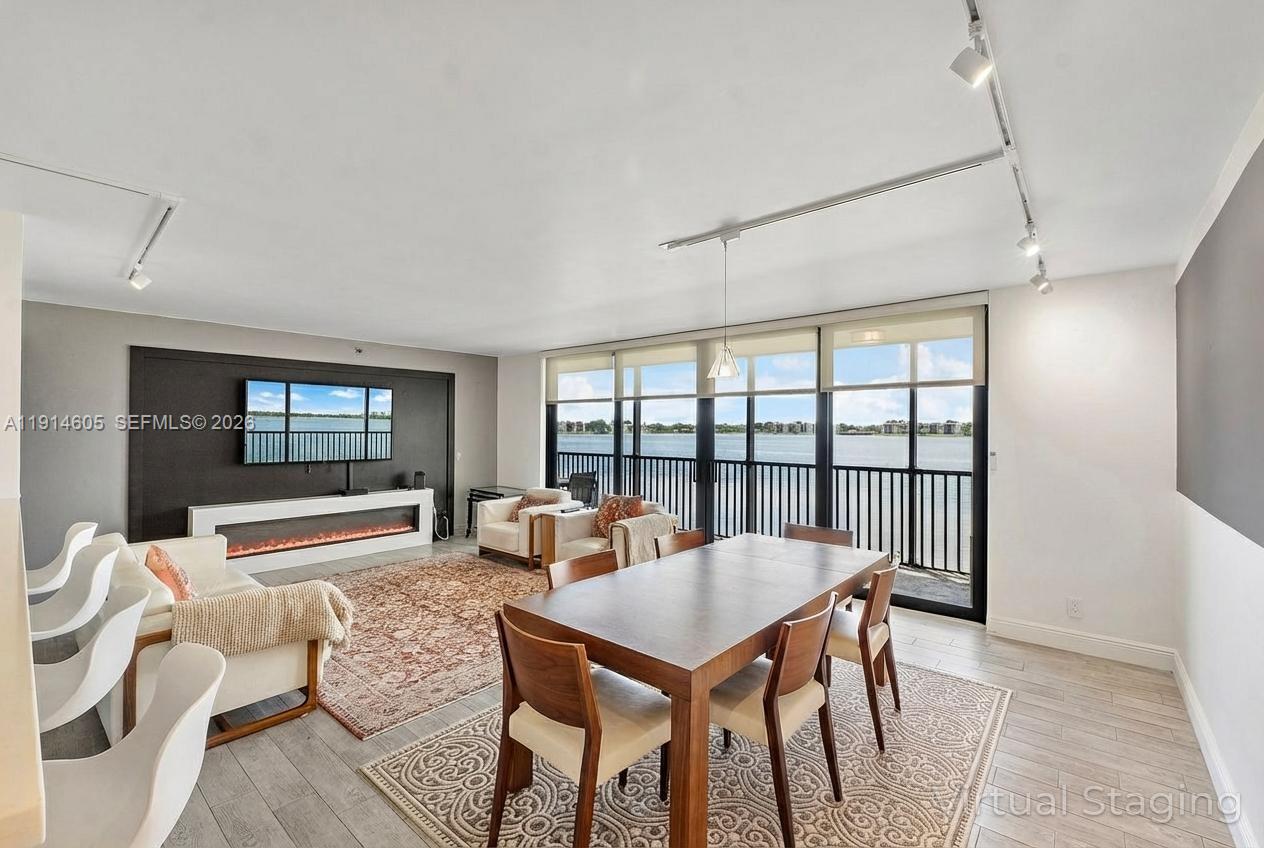 Welcome Lake Emerald! Fully renovated 2/2 with 1,300SF of interior living space. Corner unit offering amazing direct lake views from every room. Enjoy a full set of impact windows and floor-to-ceiling glass doors which open to a 32sf screened-in balcony for perfect sunrises/sunsets. The open kitchen has s.s appliances & quartz countertops. Primary bedrm has en-suite bath w/dual sinks, med. cabinets, shower & lg. walk-in closet. There’s a full-size washer/dryer, wood-style tile flooring, remote-controlled blinds, keyless entry. The guest bedrm has a Murphy bed for flexible use. Enjoy resort-style amenities: 3 pools, hot tubs, sauna, gym, sports courts, B.B.Q areas, lively clubhouse w/activities, & lakeside walking path. Close to beaches, Las Olas, Wilton Drive, airport and major highways.