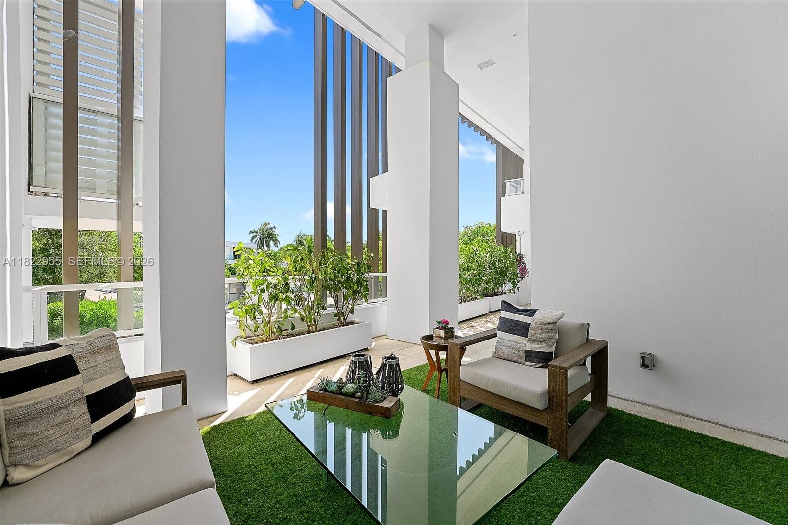 Residence 217 at The Ritz-Carlton Residences, Miami Beach offers the space of a private home with the convenience of condo living—a rare two-story masterpiece of dramatic scale and refined design. Spanning over 4,000 sq ft, the light-filled layout is anchored by 16-ft ceilings in the great room & features a sculptural glass-railed staircase & a minimalist bar. The European kitchen boasts Gaggenau appliances & seamless cabinetry, opening to a shaded wrap-around terrace for indoor-outdoor living. Upstairs, two primary suites each offer spa-inspired baths with marble walls, dual vanities, soaking tubs, oversized showers & private balconies, complemented by a lofted office overlooking the main living space. Enjoy elevated privacy & legendary Ritz-Carlton services in an architectural residence