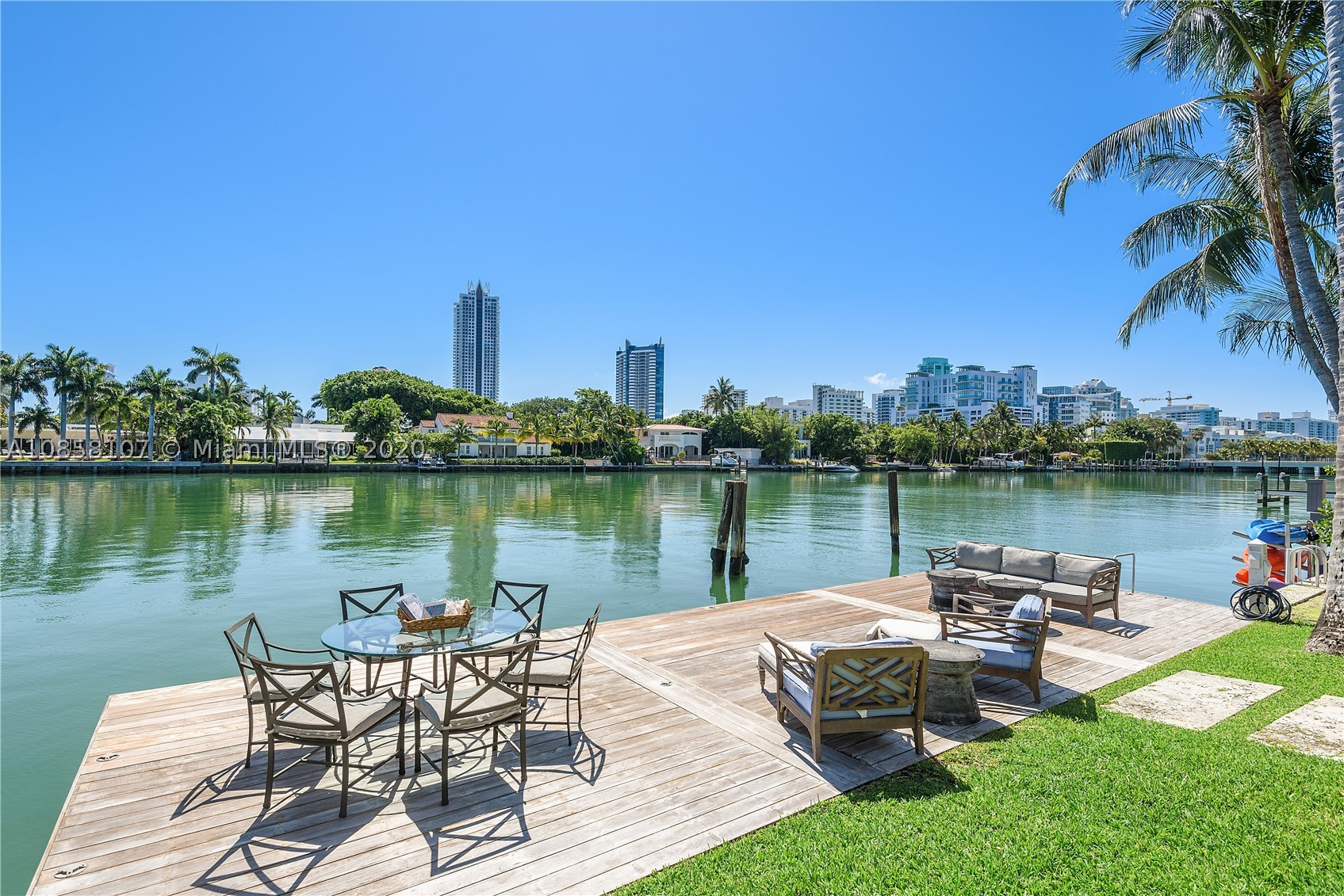 Imagine living in your very own private tropical oasis. Live a life of luxury in this Mediterranean estate in the desirable & quiet Pinetree Drive Circle. The casually elegant home features 115' direct waterfront overlooking scenic Indian Creek on a 20,815 SF lot. The 7,023 SF meticulously remolded 1935 home features 7 bedrooms, 1200 SF master suite w/ his & hers bathrooms /custom walk in closets, separate family wing, 1 BD guest apt, 3 car garage & full home generator. Enjoy a large eat-in, gourmet chef's kitchen w/ butler pantry or entertain at your outdoor kitchen/dining area with a large heated pool, outdoor shower & 2 covered pavilions. The big private boat dock and spacious backyard is perfect to relax w/friends and family. An extraordinary value and a wonderful house to call "Home".