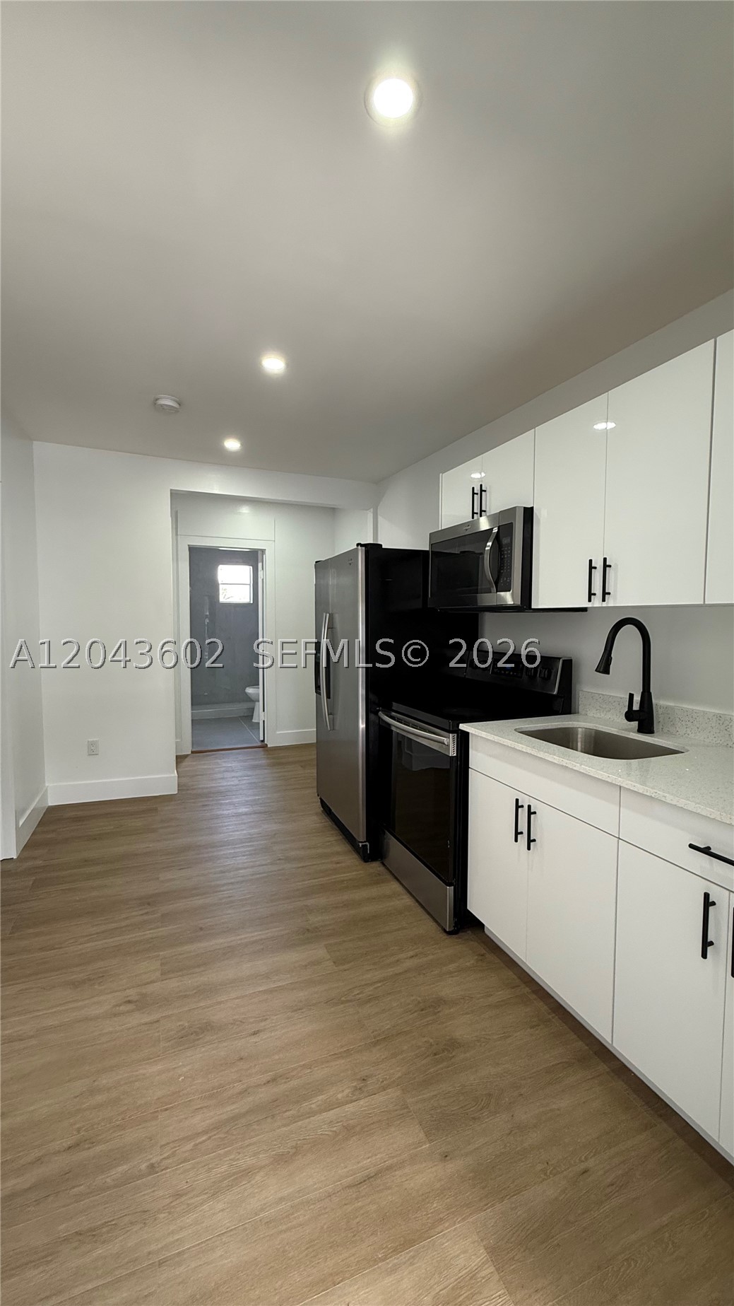 Beautifully remodeled 2-bedroom, 1-bath unit in Little Havana with a brand-new kitchen, stainless steel appliances, updated bathroom, new flooring throughout, recessed lighting, and mini-split A/C units. This bright second-floor rear unit offers a clean contemporary feel and a functional layout in a convenient location near Brickell, Downtown, the Miami River, shopping, dining, and major roads. Water, sewer, and trash are included. No on-site laundry. Nearby laundry center available on W Flagler St, just a few blocks away. Street parking only. Second-floor rear unit with stair access.