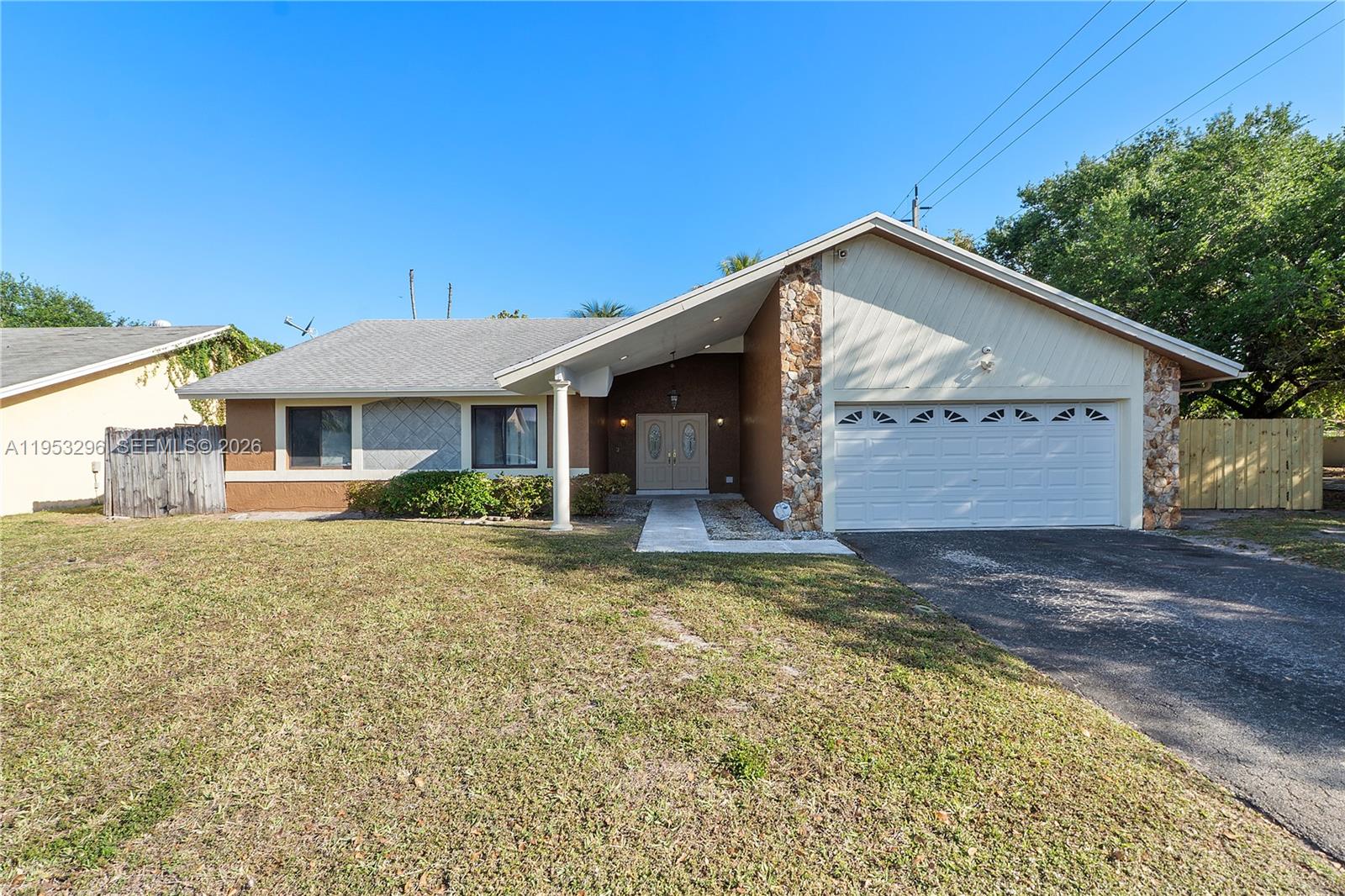 Welcome to this inviting home featuring vaulted ceilings, a well-designed floor plan, and great bones. Offering endless potential to truly make it your own. Enjoy new flooring in all three bedrooms, a 7-year-old roof, and the convenience of a two-car garage. Located in a desirable neighborhood, this home sits on a spacious corner lot providing extra space and added privacy, complete with mature fruit trees. The fully fenced backyard is ideal for pets, play, entertaining, or parking a boat or RV. Relax and enjoy outdoor living year-round on the covered and screened patio. NO HOA!