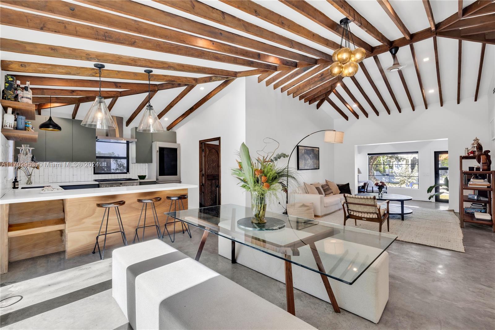 One-of-a-kind, 4-bedroom home in Miami's Buena Vista East Historic District. Chic, modern home with a mix of SoHo industrial and inspired wood features. Open concept floor plan with vaulted ceilings, concrete floors, and high-end design finishing. The kitchen includes a monogrammed professional gas range and refrigerator with integrated glass, custom-made cabinets, and carefree quartz countertops. Impact windows throughout and collapsible, bi-fold doors in the living room and master bedroom leading to the expansive deck. The fourth bedroom is the perfect area for an office space, art studio, or meditation/yoga room. Great for a family or for anyone who wants to enjoy an oversized, quiet backyard & with plenty of space to work/create from home. 10 mins to Brickell and 6 mins to Wynwood.