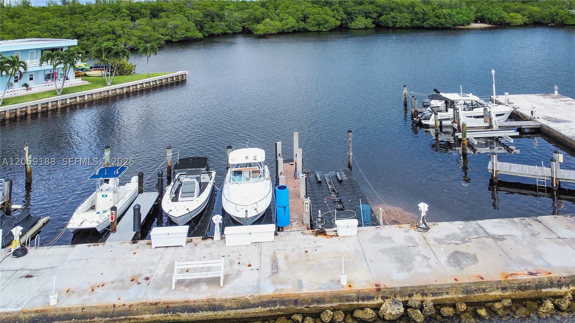 Experience sophisticated waterfront living in a resort-inspired setting with stunning panoramic views of Biscayne Bay. Enjoy seamless boating with no fixed bridges and quick access to Haulover Inlet, or explore nature by kayaking directly into the tranquil Oleta River. Spend your days fishing from the private pier or relaxing by the bayfront pool while taking in the spectacular waterfront scenery.

This rare opportunity includes a residence with its own private dock, located within the exclusive gated Fairmont House community. The home features an open, light-filled layout that creates a seamless indoor-outdoor living experience, perfect for entertaining guests or simply enjoying the refreshing bay breezes.

Residents appreciate a peaceful, low-density waterfront lifestyle enhanced by lush tropical landscaping, secure gated entry, and a quiet atmosphere rarely found in South Florida. Conveniently located just minutes from beautiful beaches, restaurants, shopping, and major highways, this property offers an exceptional combination of privacy and accessibility.

Easy to show - please call for showing instructions. Cash buyers available for co-op purchases only. No rentals permitted during the first two years of ownership.