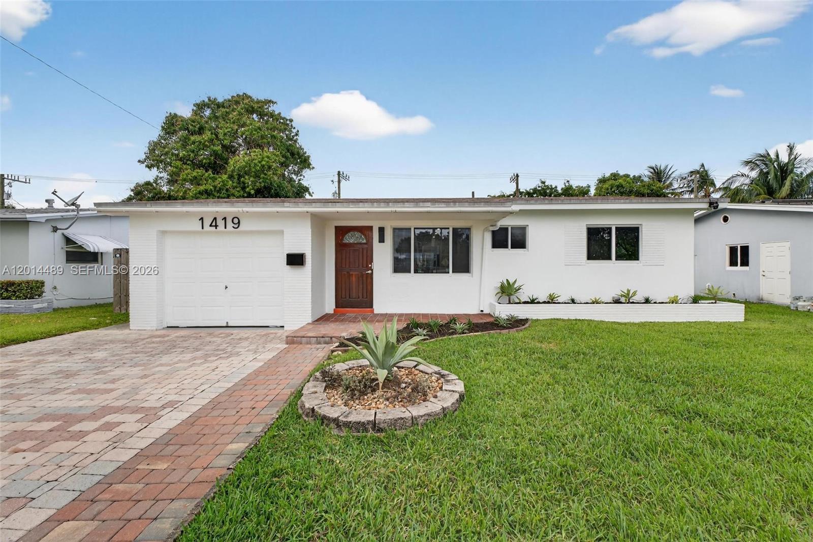 Welcome to this updated 2-bedroom, 2-bath home in a prime East Hollywood location, just minutes from Hollywood Beach, Downtown Hollywood, Young Circle, restaurants, shopping, parks, and major roadways. The home offers a bright and comfortable layout with modern flooring, refreshed interiors, an updated kitchen with stainless steel appliances, and inviting living spaces designed for everyday comfort. Step outside to a spacious private backyard featuring a large pool, paver patio, screened-in outdoor area, and plenty of room to entertain, relax, or enjoy the South Florida lifestyle. A standout feature is the rear private access from the back road, offering added flexibility for trailers, RVs, work vehicles, or additional parking needs. Move-in ready and ideally located, this property is a great opportunity for buyers looking for lifestyle, convenience, and outdoor space in one of Hollywood’s most desirable east-side areas.