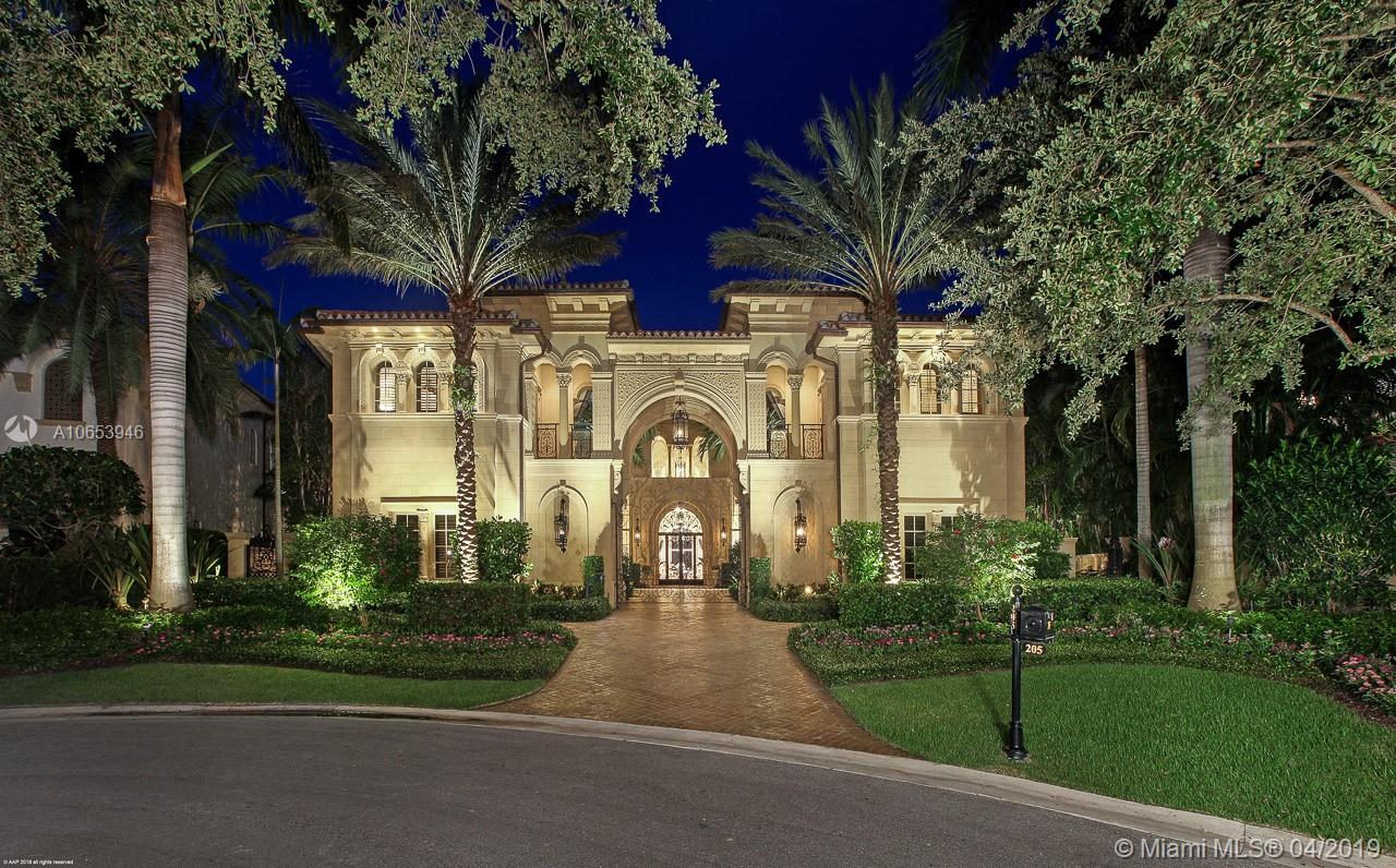 DIRECT INTRACOASTAL WITH 190' OF WATER FRONTAGE... When entering this gated signature estate you know you are in true paradise. This home features 7 bedrooms, with 2 separate guest homes each with their own private entrances, custom walnut office with wet bar & views of Intracoastal, state of the art gym with steam shower, sauna and therapy spa, dome dining room with seating for 12, 3 laundry rooms, fireplace, all hand carved marble columns, 8 car garage (can have lifts to increase to 10), 2 golf cart garage, high-end EVERYTHING. The luxurious master suite has his and hers baths, custom closets, balcony over looking waterways with a bonus room and bath attached. Enjoy hours of relaxation under the covered patio with summer kitchen, ceiling fans and electric drop down screens.