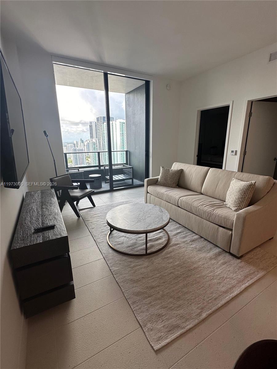 Located on the 48th floor, this 584 sqft one-bedroom condo offers stunning skyline views and an unbeatable location in the heart of Miami Worldcenter. Thoughtfully furnished, the residence features a king-size bed, sofa bed, dining area, fully equipped modern kitchen with stainless steel appliances, and contemporary décor throughout. It also includes an in-unit washer and dryer and one Smart TV for added convenience and comfort.

At Gale Miami, enjoy over 55,000 sq. ft. of resort-style amenities—including a rooftop pool and bar, full-service spa with hammam and sauna, and a state-of-the-art fitness center. With flexible daily rentals and a prime location steps from the Kaseya Center, Brickell, and the Brightline station, this residence perfectly blends luxury living with strong investment potential.