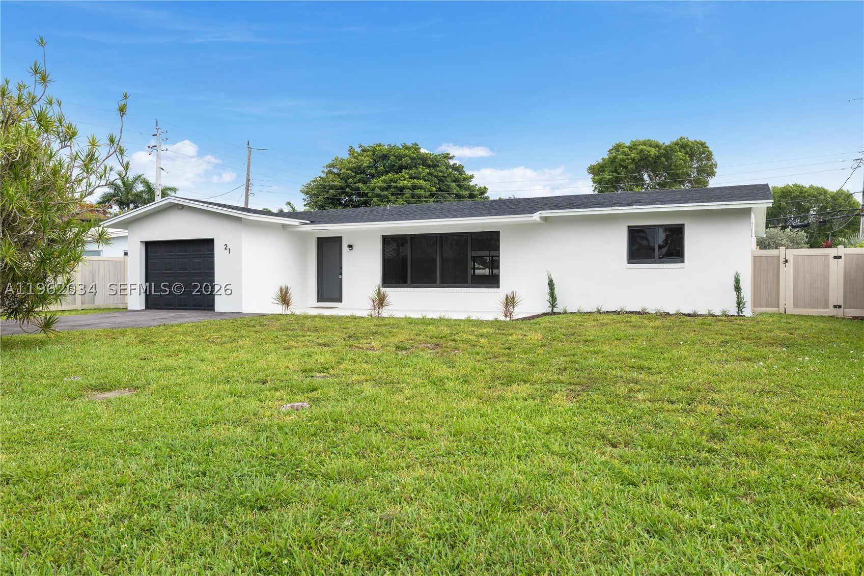 Beautifully renovated, move-in-ready residence filled with natural light and bright, modern finishes throughout. An exceptional split floor plan offers comfort, functionality, and privacy—perfect for everyday living and entertaining. Enjoy peace of mind with a brand-new roof, 2020 A/C unit, updated electrical, full impact windows and doors, and new appliances. Ideally located near parks, shopping, and dining, and just minutes from the beach, this home offers the best of South Florida living in a highly desirable setting.