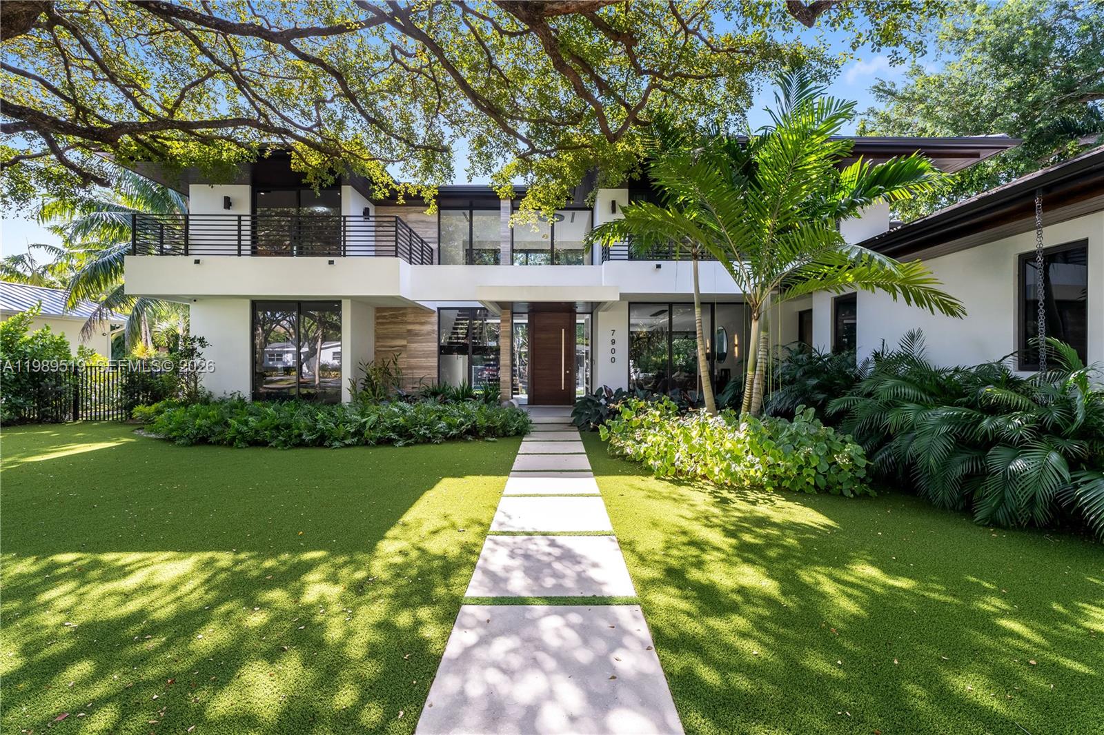 This stunning 2023 home blends modern design with exceptional craftsmanship. Offering 4,866 SF of living space
(6,375 SF total) on a 13,500 SF lot, it features 6 beds & 7 baths, meticulously finished with custom details such as
trimless lighting & AC ducts and a cozy living room fireplace. A grand double-height entrance with a pivot door
leads to a bright, open floor plan. The master suite, on the ground floor, includes a luxurious bathroom with his-
and-hers vanities, a freestanding tub, generous walk-in closets, and a private balcony. Additional features include
porcelain floors, laundry room. The lush, private garden features a heated pool, covered terrace, and a fully-
equipped summer kitchen. Ideally located in South Miami close to Miami’s best private schools & business centers.