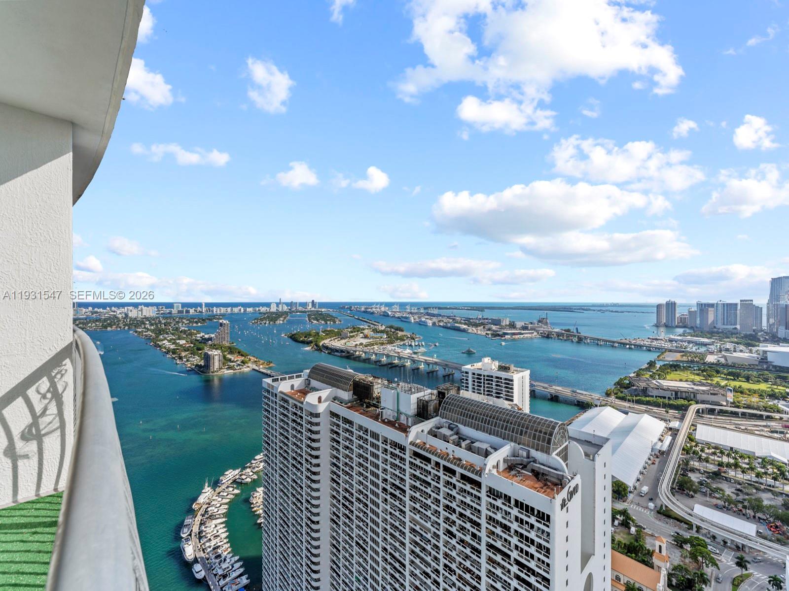 Experience luxury living with 180° views of Biscayne Bay, the Miami skyline, and city lights from this sought-after south-facing unit. Completely furnished and move-in ready, featuring modern design, Wi-Fi, cable, and private assigned parking. Enjoy resort-style amenities including pool, gym, hot tub, sauna, 24/7 concierge/security, and onsite conveniences such as a coffee shop, grocery store, and salon. Centrally located near Downtown, Brickell, Wynwood, Design District, Miami Beach, and the airport. 30-day minimum rentals allowed, offering excellent flexibility and strong investment potential. Currently generating close to $5,000 per month in short term rental bookings. Great Investir deal! Lowest HOA payment in the building helping cashflow!