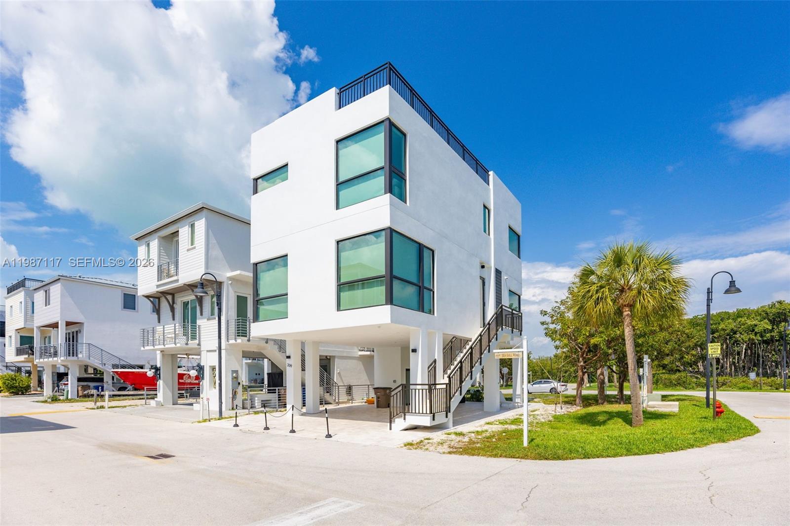 Experience luxury coastal living at its finest in this exceptional corner residence located in the highly sought-after Key Largo Ocean Resort. This stunning three-level new construction home features a private elevator and a spectacular rooftop terrace offering breathtaking panoramic ocean views—enjoy sunrise and sunset vistas from the terrace and every room.

Designed for the most discerning buyer, the home showcases porcelain flooring throughout, superior craftsmanship, and comes beautifully furnished for immediate enjoyment. Every window features serene ocean views, creating a bright and tranquil atmosphere throughout the residence.

Perfect as a primary residence, vacation home, or investment property, this home offers no rental restrictions—ideal for both annual and seasonal rentals.

Key Largo Ocean Resort is a gated community with 24-hour security and resort-style amenities including a clubhouse, pool, fitness center, pickleball courts, tennis courts, and basketball courts. Enjoy direct ocean access and the ultimate Florida Keys lifestyle.