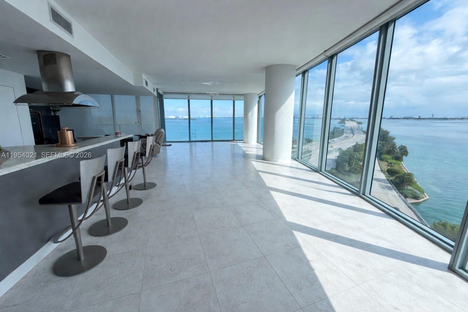 Spacious 1,870 sq ft corner residence in one of the most desirable lines in the building, offering unobstructed water views from every room with stunning views of the bay and Miami Beach. Floor-to-ceiling windows fill the space with natural light, creating a bright, open layout ideal for both living and entertaining. This sought-after floor plan features 2 bedrooms with en-suite baths plus a guest bath, and an expansive living and dining area with excellent flow throughout. Priced to sell and one of the best values in the line, this residence presents a great opportunity to customize and create your ideal waterfront home. Includes 2 assigned garage spaces, 1 valet space, and a private storage unit. Full-service building with resort-style amenities.
Photos are of the actual unit. Furniture has been digitally removed to better illustrate the space and layout.