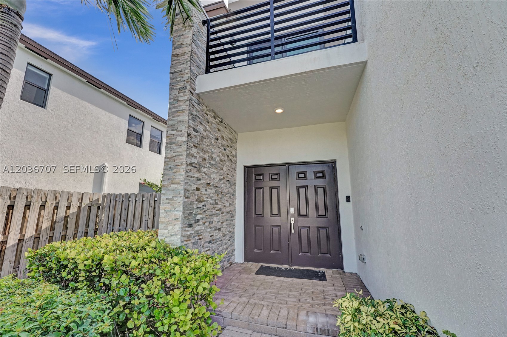 Experience modern living in this beautifully maintained 4-bedroom, 3-bath SMART home located in a desirable gated community. Designed for both comfort and style, this residence features full impact-resistant windows and doors, energy-efficient construction, and a versatile floor plan with a full bedroom and bathroom on the first floor—ideal for guests or a home office.

The spacious primary suite offers a luxurious en-suite bathroom with a soaking tub, separate shower, and two generous walk-in closets. Upstairs has been enhanced with luxury vinyl plank flooring, while sleek impact glass stair railings add a contemporary touch.

The gourmet kitchen is equipped with quartz countertops, stainless steel appliances, and ample cabinetry, opening to bright and inviting living spaces. Additional highlights include a tankless water heater, dedicated laundry room with washer and dryer, and a spacious two-car garage.

Step outside to a private backyard with room to add a pool and create your own outdoor oasis. Enjoy the benefits of gated community living with security, a clubhouse, resort-style pool, fitness center, and expansive green space just across the street.

Move-in ready and loaded with upgrades—this exceptional home offers the perfect blend of modern design, convenience, and lifestyle.
