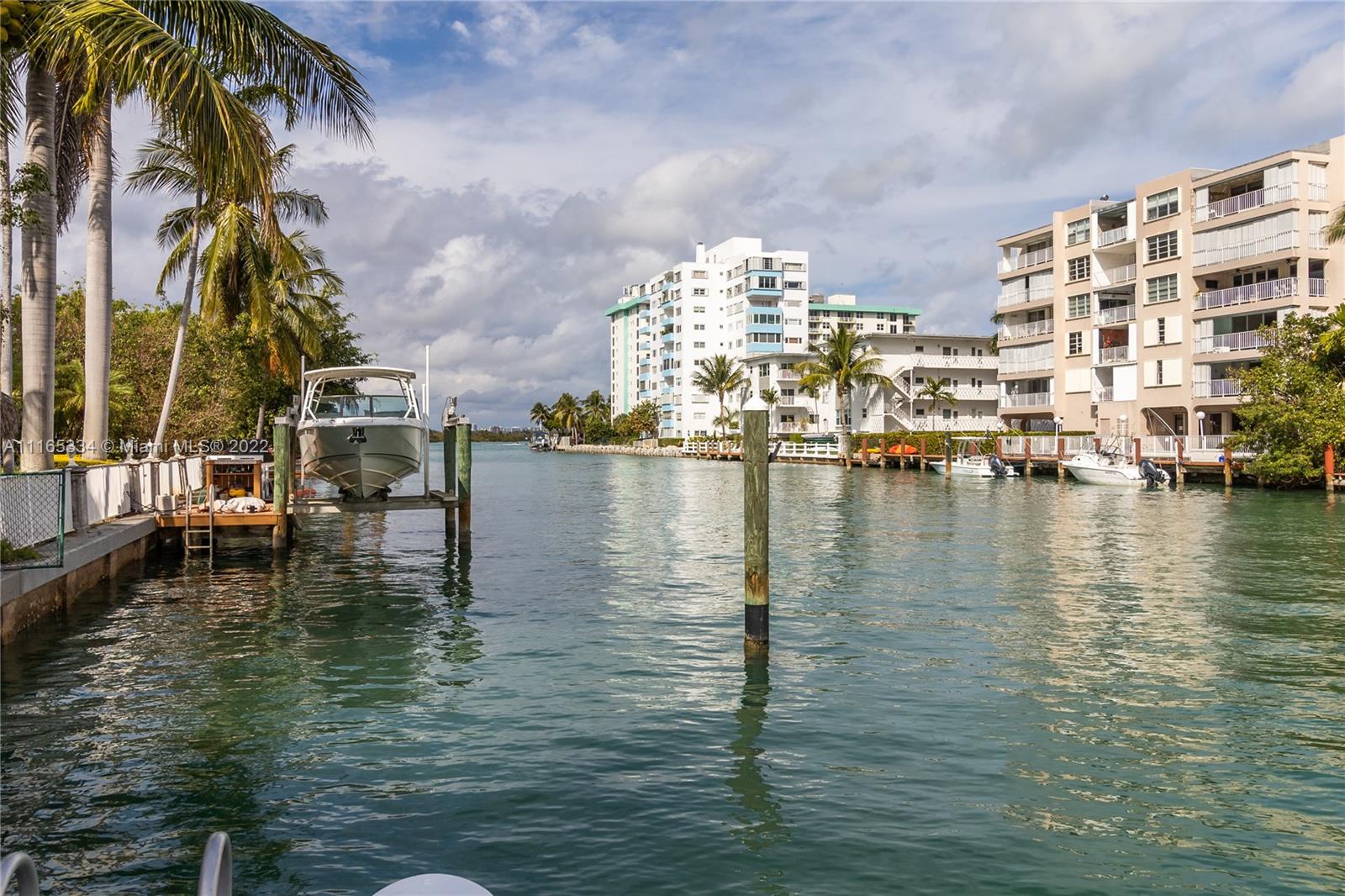Modern two story waterfront residence, designed by Kobi Karp in  Prestigious Bay Harbor Island, situated on 11,250 sf lot with 75 feet of water frontage. This is a boaters dream home no bridge to bay and direct ocean  access with private dock and bonus floating dock for jet ski's . Configuration of the house features 4 BD suites and 6 baths plus a cabana room with full bath that can be a great gym or in-law quarters. House features 24-foot ceiling heights in foyer with an open floor plan that offers  an abundance of natural light. Enjoy the beauty of Florida living from any one of the  stunning four custom balconies.  Beautiful tropical saltwater pool/ jacuzzi surrounded by your private garden that will make you feel like your in paradise.