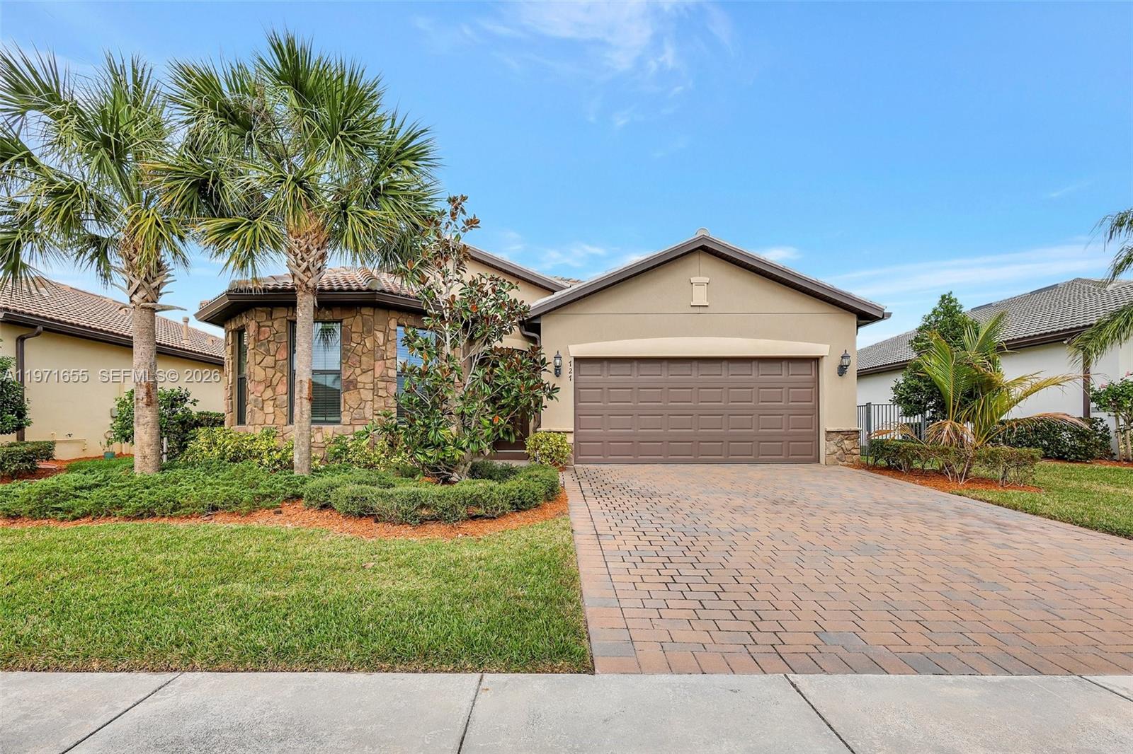 Lakefront living, modern design, and resort-style amenities — all in one move-in ready home.

Welcome to effortless Florida living in this beautifully maintained 3BR/2BA lakefront home located in the gated community of Veranda Gardens. Built in 2020, this modern residence offers the perfect blend of style, comfort, and low-maintenance ease. The open-concept layout is filled with natural light and features wide-plank wood-look tile flooring throughout, creating a seamless and sophisticated feel.

The kitchen is designed for gathering, with crisp white shaker cabinetry, elegant quartz countertops, stainless steel appliances, a gas range, and a spacious island that anchors the living space. The natural flow between the kitchen, dining, and living areas makes entertaining both easy and inviting.

Wake up to serene lake views from the private primary suite, thoughtfully positioned for both comfort and privacy. Step outside to the extended screened lanai overlooking the water — the perfect setting for morning coffee, sunset dinners, and quiet evenings. There is also ample room to add a future pool and create your ideal backyard retreat.

Residents enjoy resort-style amenities including a clubhouse, two pools, a fitness center, pickleball, tennis, and social spaces. The HOA includes lawn care for true lock-and-leave living.