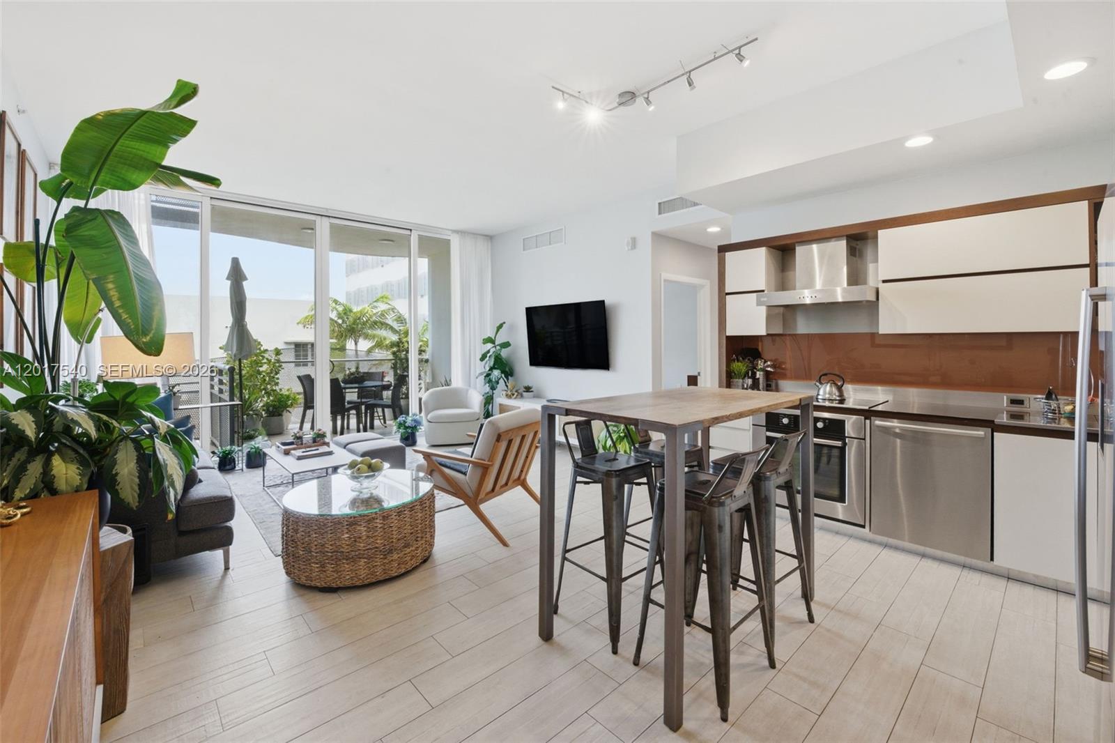 Discover refined Miami Beach living in this stunning 2-bedroom, 2-bathroom residence featuring 981 square feet of meticulously designed space with soaring 10'5" ceilings and floor-to-ceiling windows that flood the home with natural light. This sophisticated condominium offers modern finishes throughout and an open-concept layout perfect for both relaxation and entertaining.

The building provides resort-style amenities including dual modern pools, state-of-the-art fitness center, community room with gaming facilities, convenient valet parking, and exclusive beach service. Located directly across from The Bass Museum in Miami Beach's prestigious Arts & Cultural District, you're just one block from pristine beaches and surrounded by iconic Art Deco architecture. This exceptional residence perfectly blends modern luxury with cultural sophistication in one of Miami Beach's most desirable neighborhoods.
