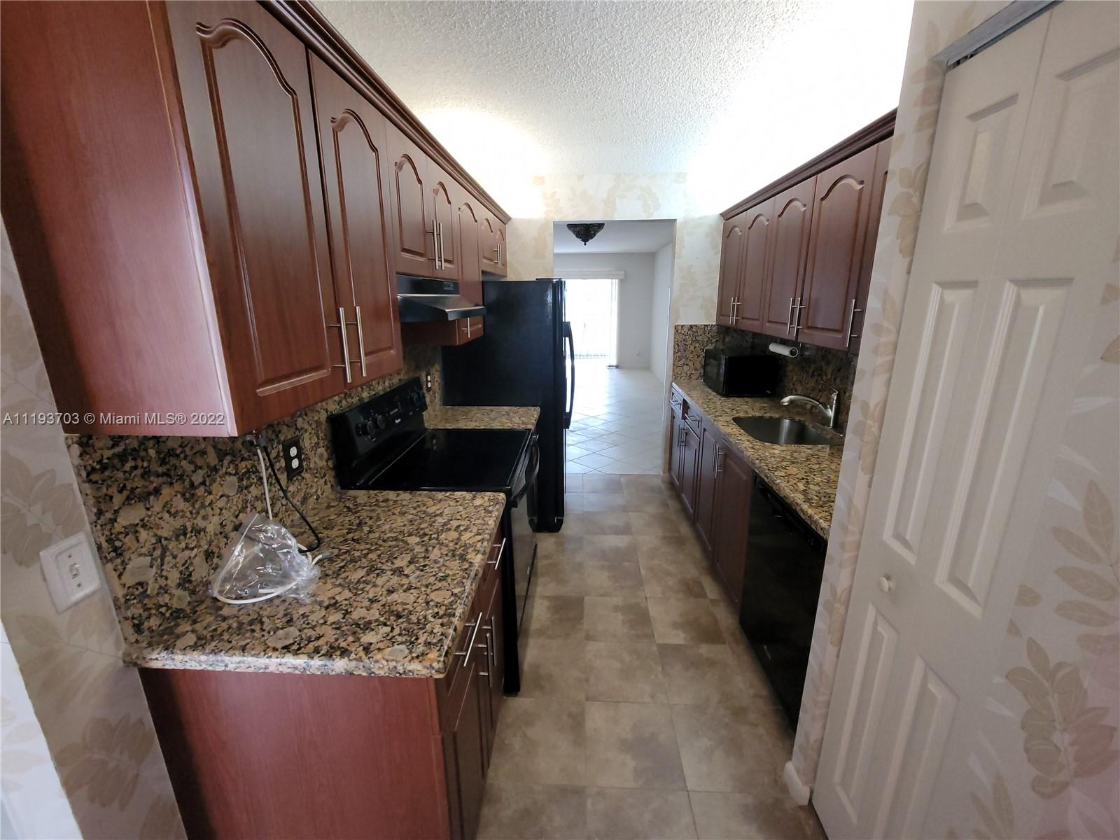 2 bedroom 2 bathroom with a breakfast nook and a galley kitchen that leads directly into the dining room.  All tiles throughout the entire condo except for the bedrooms, which recently had new carpets installed. The unit is equipped with a washer and dryer inside. Hurricane accordion shutters all around. Feel secluded and at peace with complete privacy on the enclosed patio. This allows you the luxury to enjoy the outdoors while enjoying the nice cool air conditioner from the comfort of the patio. A peaceful view of the decorative and manicured landscaping. Eastern exposure view from the patio. Million-dollar clubhouse, bus transportation,2 fitness centers, 24 hr security, 8 swimming pools, tennis, movies, theater, billiards, pharmacy, cafe, golf, and much more.