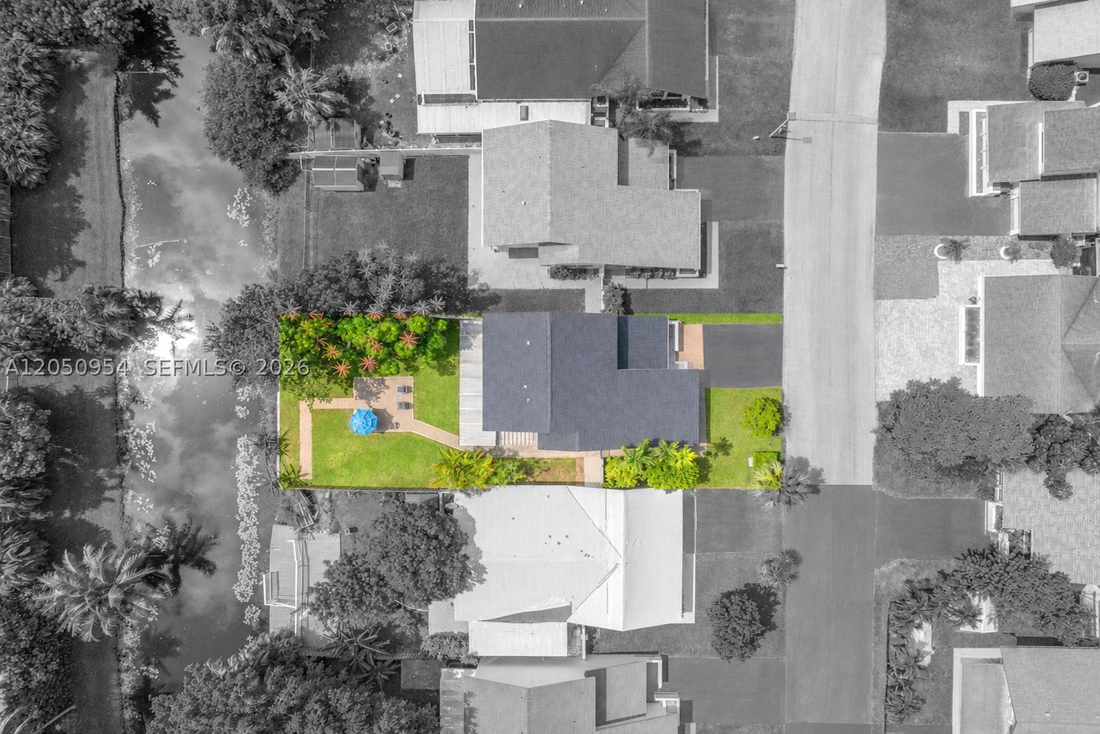 Welcome to this beautifully renovated 3 bedroom, 2.5 bath home located in the desirable Alpine Woods community within the Rolling Hills area of Davie. A double door entry opens to a bright and spacious living and dining area, enhanced by large windows and sliding glass doors that fill the home with natural light. Recent upgrades include a 2024 roof and impact windows and doors. The updated kitchen features modern white shaker cabinets, granite countertops, stainless steel appliances, and additional cabinetry that provides excellent pantry and storage space. All 3 bathrooms have been tastefully renovated with stylish finishes. Large sliding glass doors lead to a covered, screened-in patio, creating the perfect space for relaxing or entertaining while overlooking the spacious backyard and peaceful canal. A long driveway offers ample parking, completing this move in ready home. Located close to parks, dining and shopping.