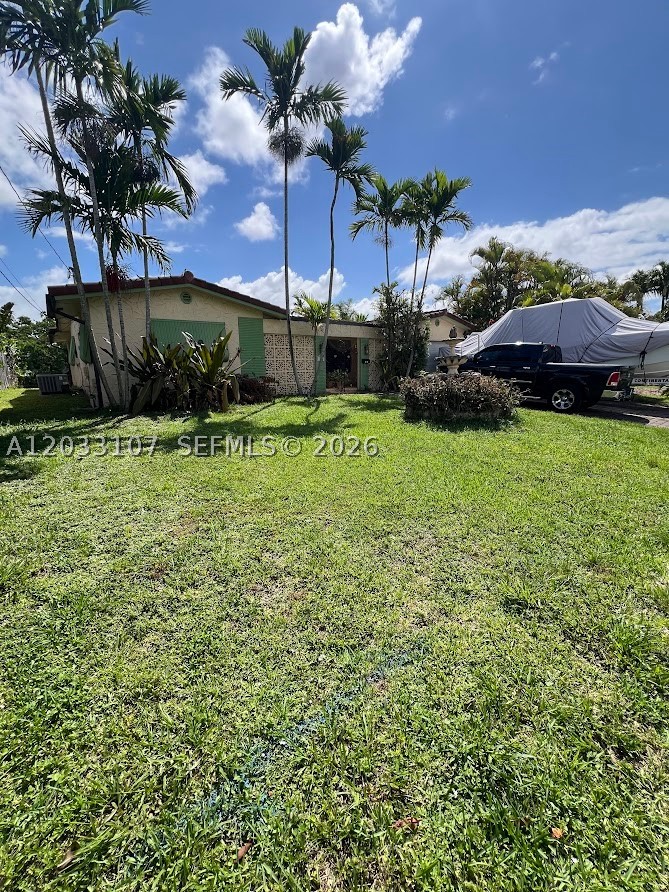 Welcome to Royal Palm Acres, one of Oakland Park's most sought-after waterfront communities. This well-maintained 3-bedroom, 2-bath home offers the perfect blend of comfort, charm, and outdoor living. Situated on a beautiful waterfront lot, you'll enjoy peaceful water views and a backyard designed for relaxation and entertaining. Inside, the home features a spacious layout with tile flooring throughout, generous living areas, and plenty of natural light. The kitchen offers ample cabinet and counter space, while the primary suite provides a comfortable retreat with an updated bathroom. The additional bedrooms are well-sized and ideal for family, guests, or a home office. One of the standout features of this property is the expansive covered patio overlooking the water. Whether you're hosting family gatherings, weekend barbecues, watching the game with friends, or simply enjoying your morning coffee, this spacious outdoor area offers endless possibilities. Complete with a custom outdoor bar and plenty of room for seating, it's the perfect space to enjoy the South Florida lifestyle year-round. The backyard is beautifully landscaped and provides a tranquil setting with direct waterfront views. Conveniently located near shopping, dining, parks, beaches, and major highways, this home offers both privacy and accessibility. Whether you're looking for a primary residence, a seasonal getaway, or an investment opportunity, this waterfront property is one you won't want to miss.