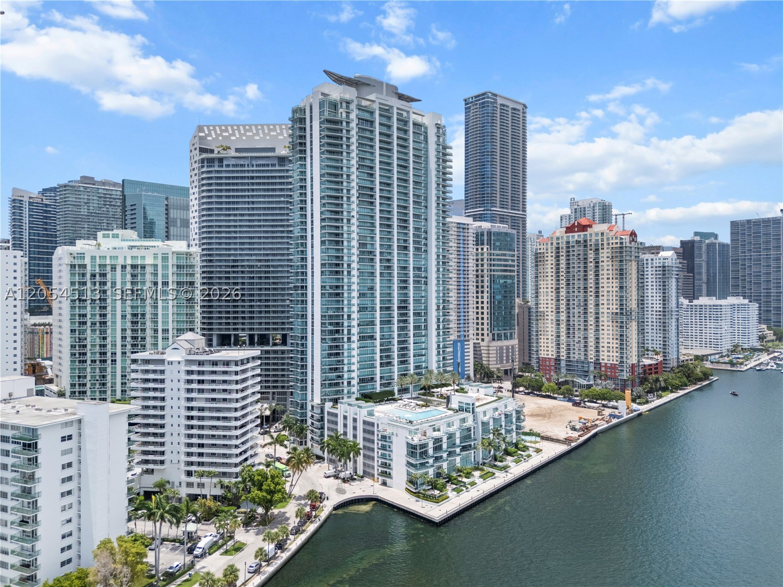 Welcome to Unit 2601 at Jade Residences at Brickell Bay, a spectacular NE corner residence in the heart of the Brickell Financial District with panoramic views of Biscayne Bay and the Atlantic Ocean. Bathed in natural light, this spacious residence features a private elevator entry and foyer opening to expansive living areas framed by floor-to-ceiling glass. Oversized covered terrace ideal for sunrise views and entertaining, offering seamless indoor-outdoor living with breathtaking water views from multiple rooms. Includes 2 assigned parking spaces and private storage. Furniture negotiable. Full-service waterfront building offering resort-style amenities in a premier bayfront location, just moments from Brickell's finest dining, shopping, and entertainment.