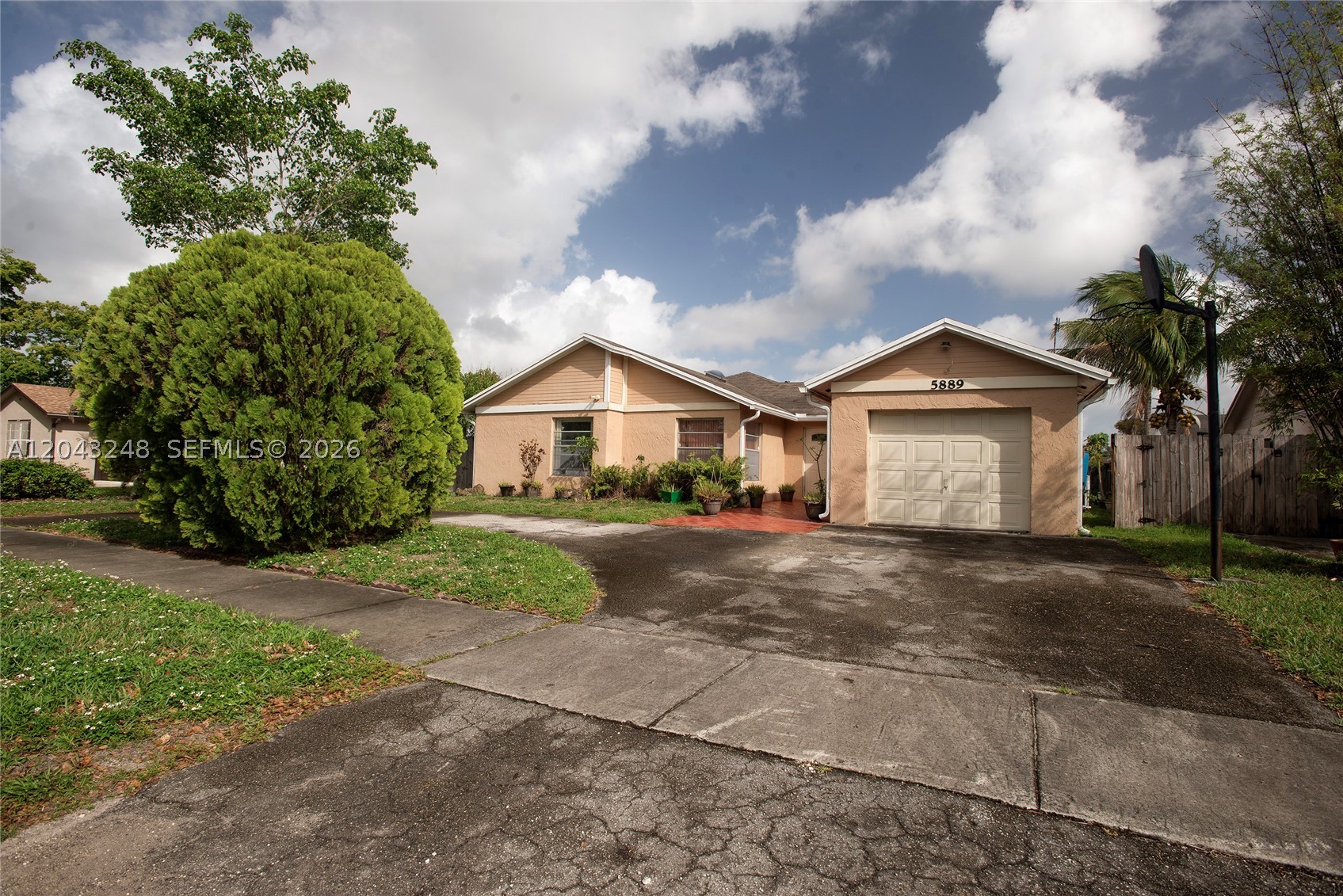 Beautiful 4-bedroom, 2-bath home situated on a spacious 7,823 sq. ft. lot with mature fruit trees.  Well maintained in its original condition, featuring impact windows for added safety and efficiency.  Located in a highly desirable area with convenient access to major highways, shopping, dinning, and schools.  A rare opportunity with endless potential in a prime location!!!