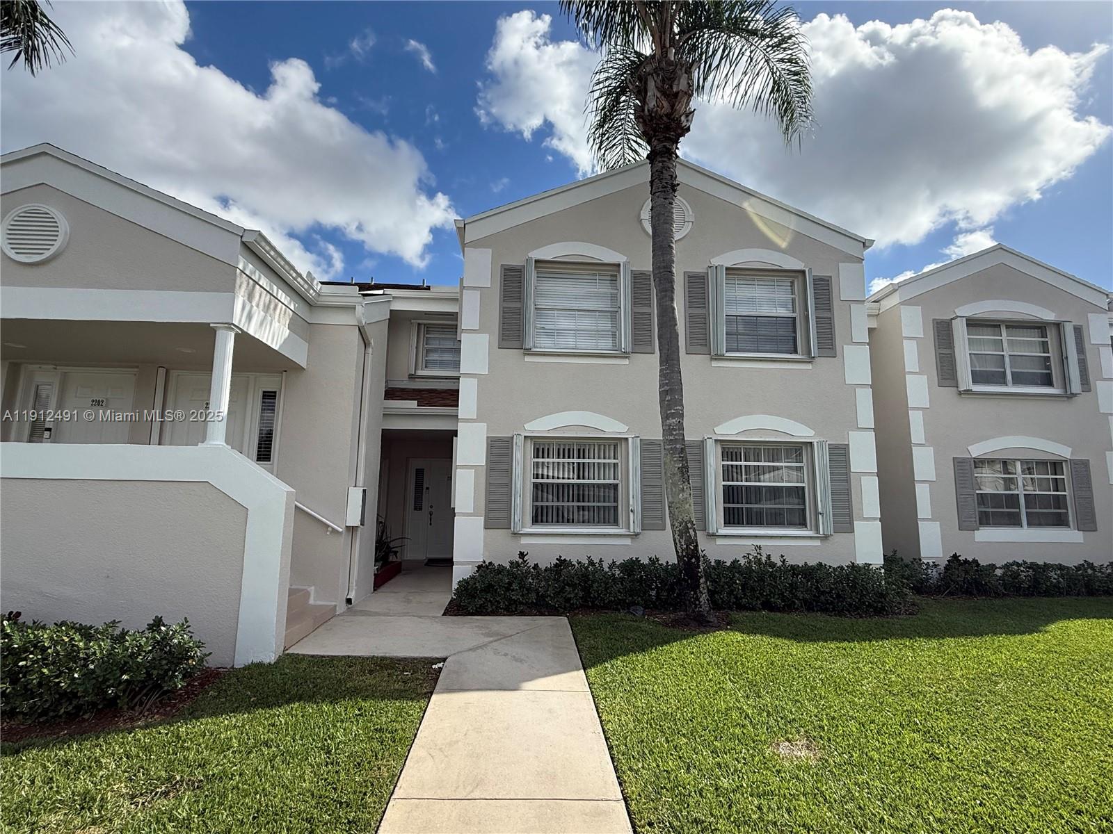 Beautifully renovated condo move in ready! Features new flooring, baseboards, ceilings, two spacious bedrooms, and two fully remodeled baths. The modern kitchen boasts quartz countertops and brand new appliances. Enjoy in-unit washer/dryer and a screened balcony with peaceful garden views. Accordion hurricane shutters provide added protection. HOA includes AT&T cable, high-speed internet, alarm, water, pest control, exterior insurance, security, and access to a resort-style clubhouse with pool, jacuzzi, gym, theater, game rooms, library, and more. A must-see!